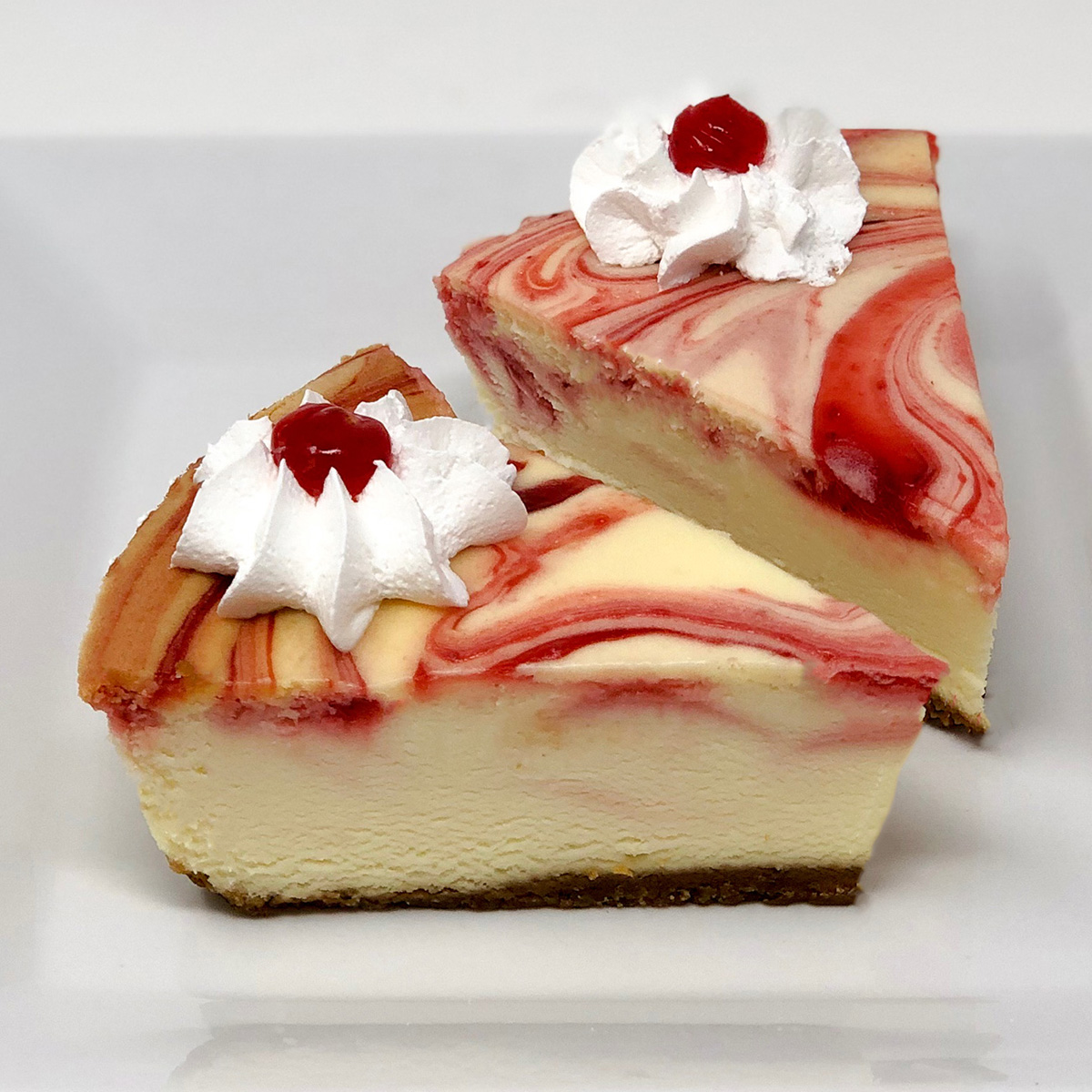 Order Cheesecake Slice - Strawberry food online from Merritt's Bakery  store, Tulsa on bringmethat.com