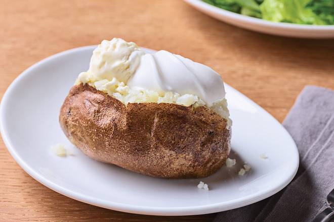 Order Side Baked Potato w/Butter & Sour Cream food online from Applebee store, North Canton on bringmethat.com