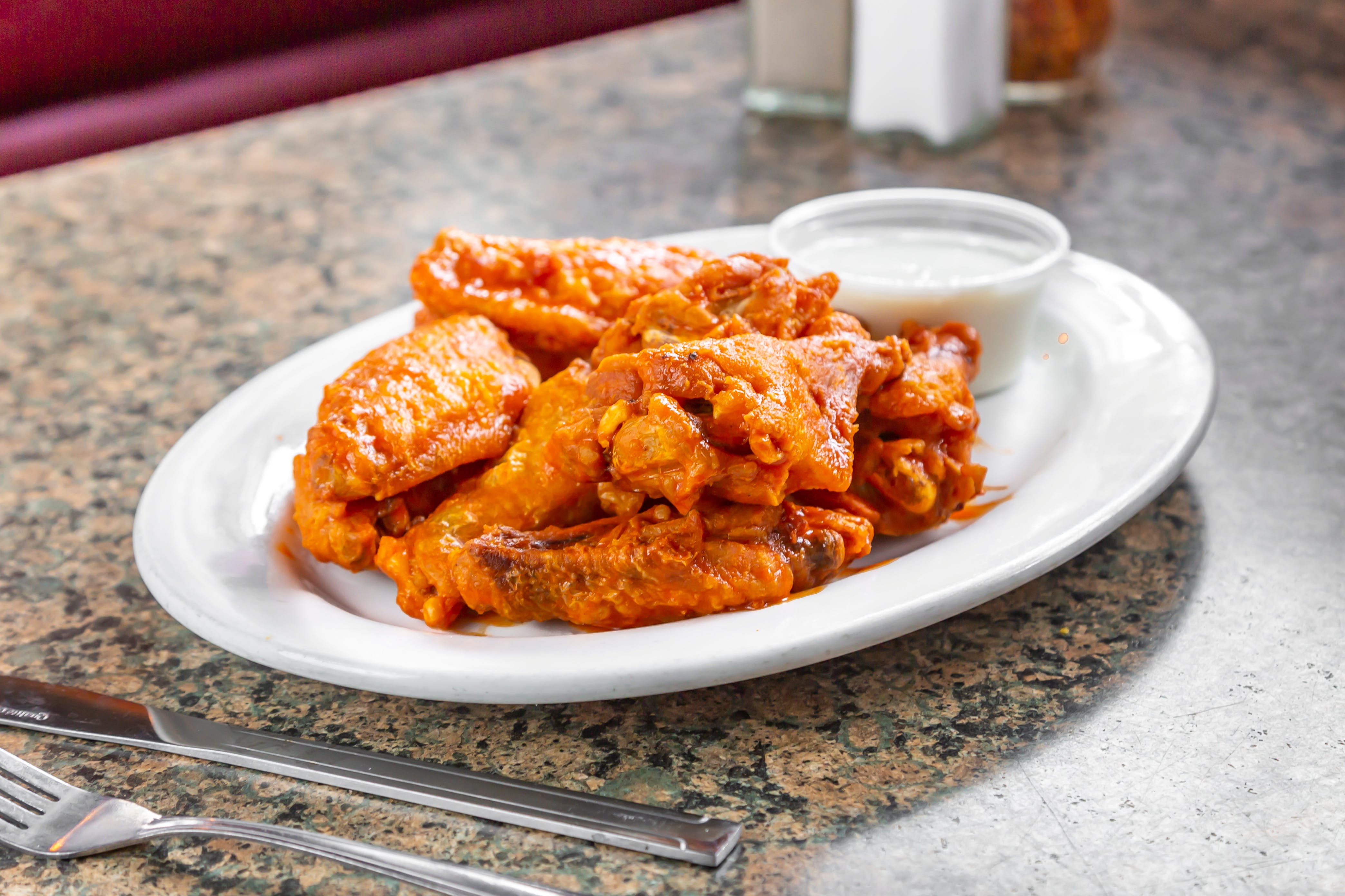 Order Wings - Wings food online from Pizza Palace Restaurant store, Enfield on bringmethat.com