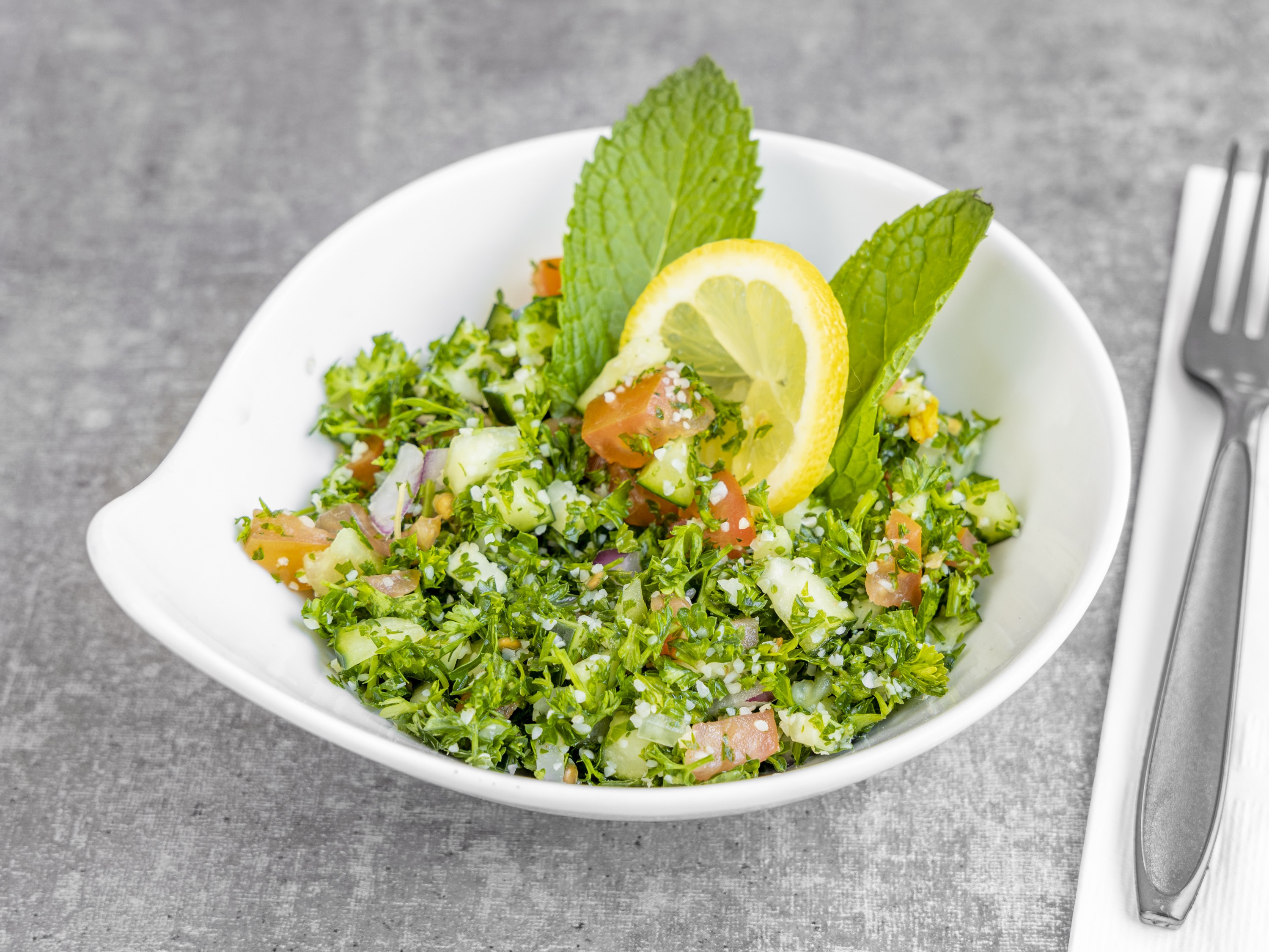 Order Tabbouleh food online from Momos Grill store, Irvine on bringmethat.com