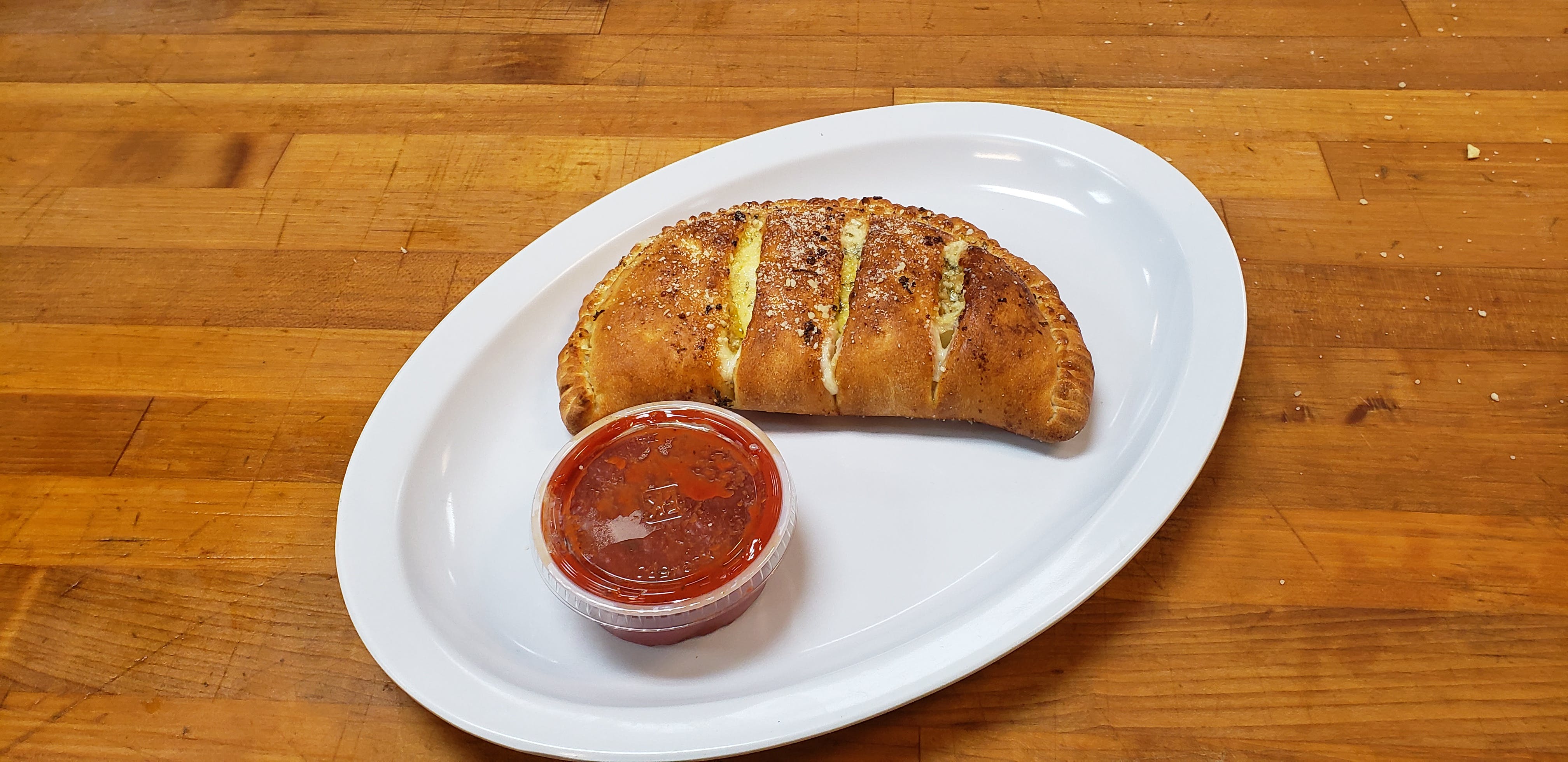 Order Calzone - Regular food online from Bellacino Pizza & Grinders store, South Point on bringmethat.com