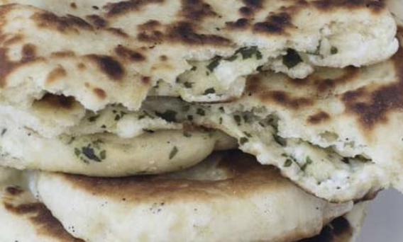 Order Goat Cheese Spinach Truffle Naan food online from Madam Ji store, New York on bringmethat.com