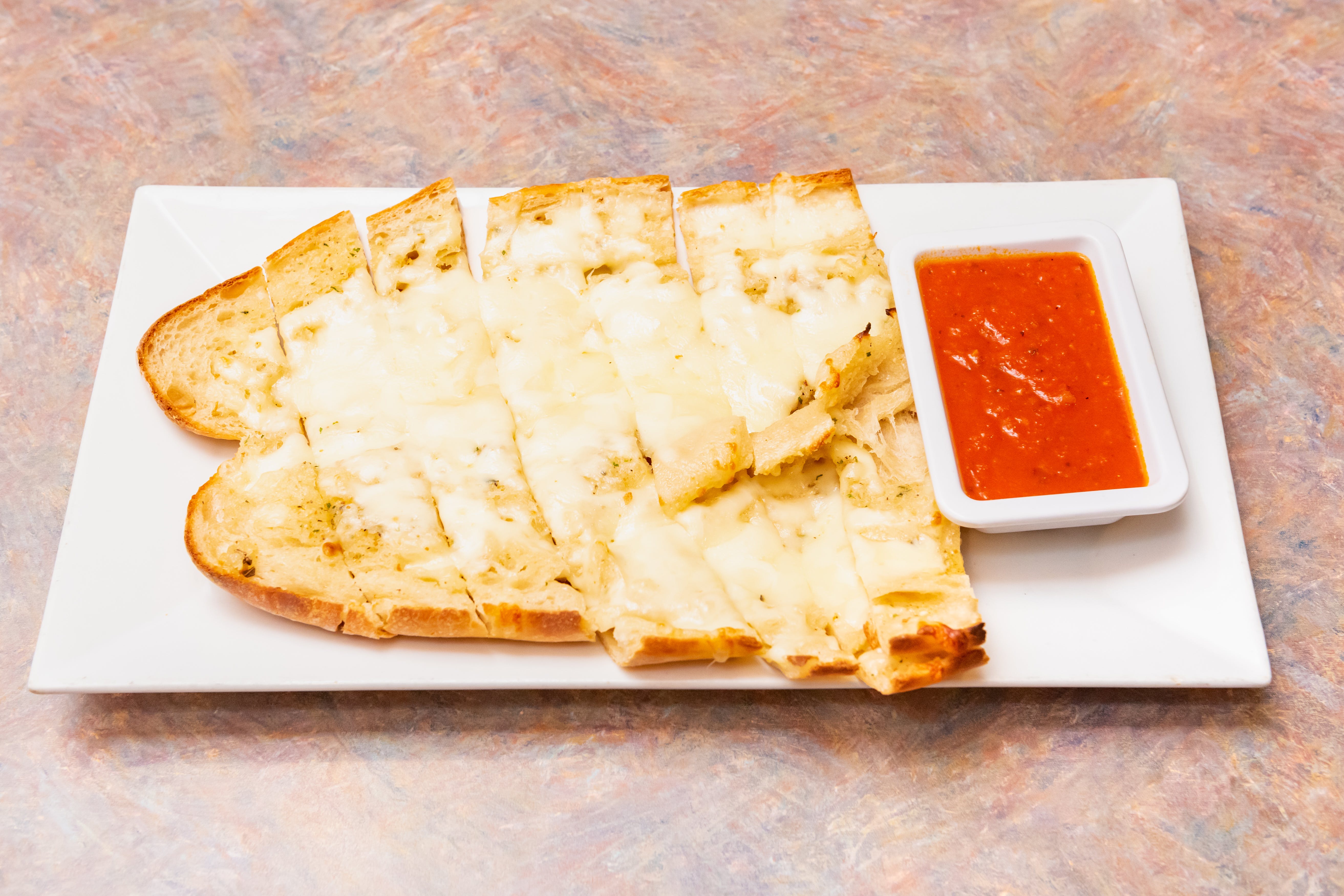 Order Garlic Bread with Cheese - Appetizer food online from Anthony Restaurant store, Torrington on bringmethat.com
