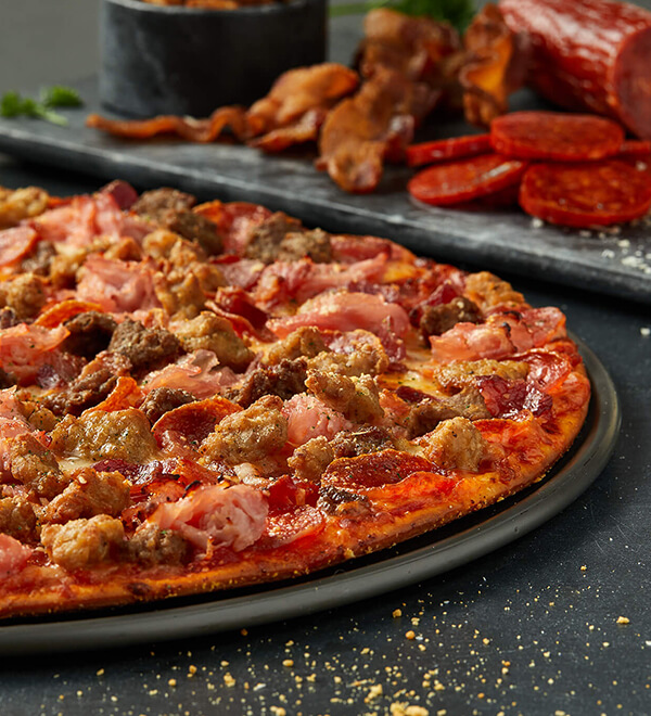 Order Serious Meat Pizza food online from Donatos Pizza store, Delaware on bringmethat.com