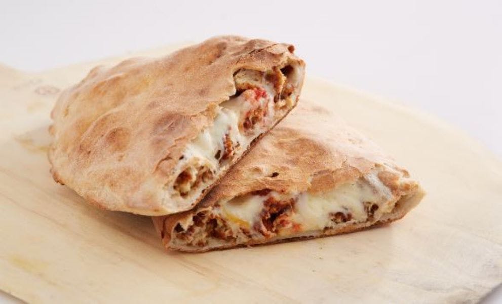 Order Chicken Parmesan Calzone - Calzone food online from Sal Pizza store, Laconia on bringmethat.com