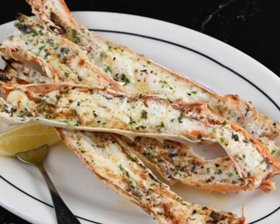 Order Herb Butter Broiled Alaskan King Crab Legs food online from Simms Steakhouse store, Golden on bringmethat.com