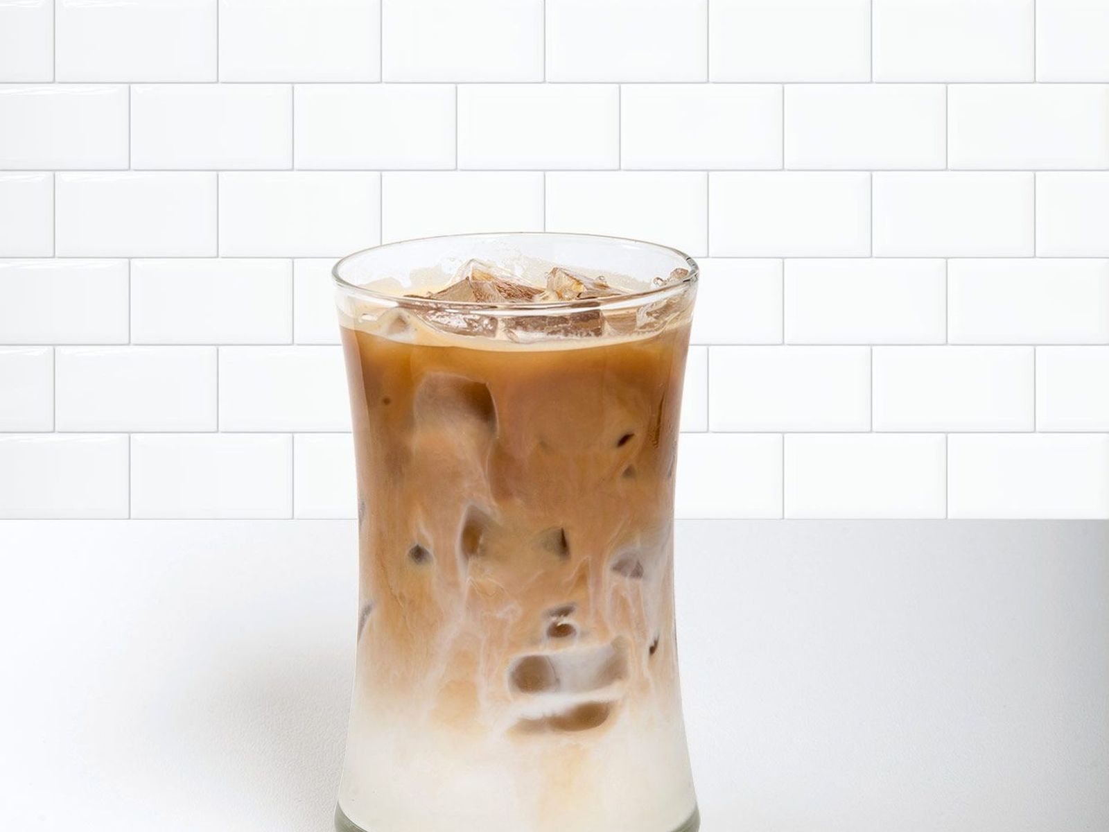 Order Iced Latte food online from Pj Coffee store, Pearland on bringmethat.com