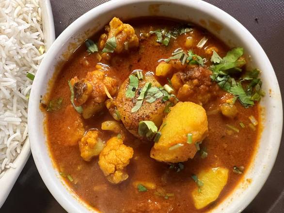 Order Aloo Gobhi food online from Masala & Curry store, Nashville on bringmethat.com