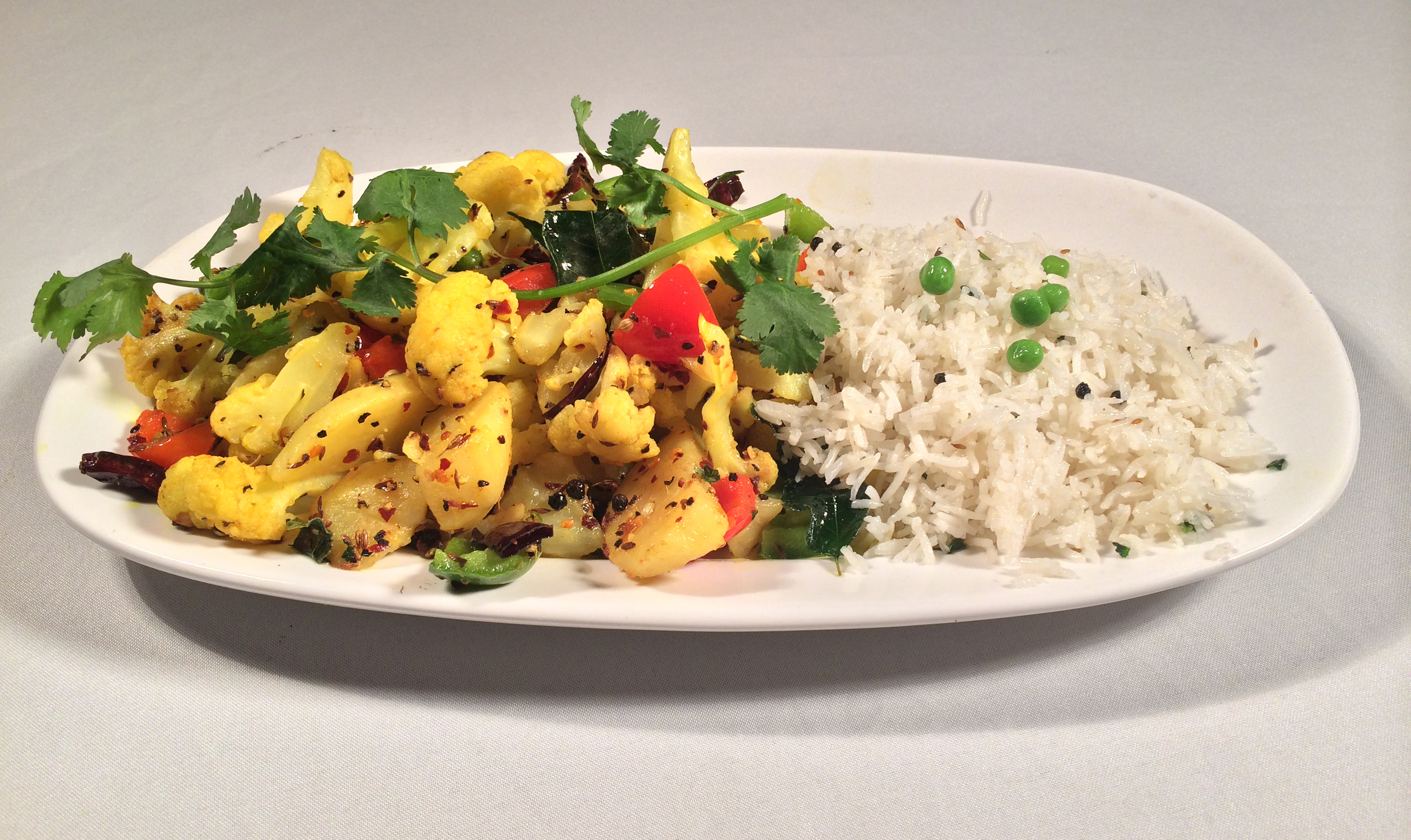 Order 50. Masala Aloo Gobi food online from All India Restaurant store, Pittsburgh on bringmethat.com