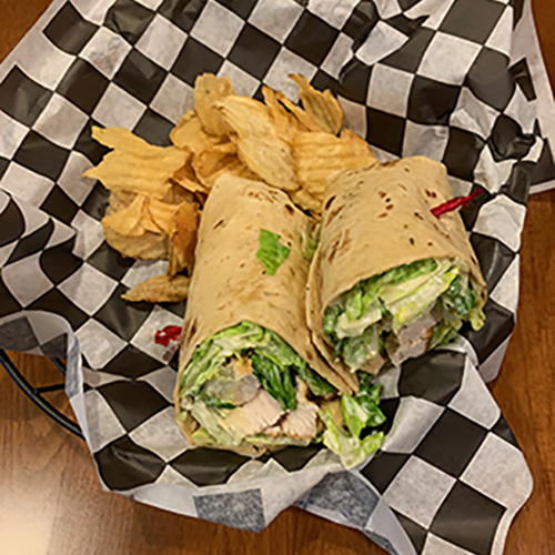 Order Chicken Caesar Wrap food online from The Woodford Club store, Versailles on bringmethat.com