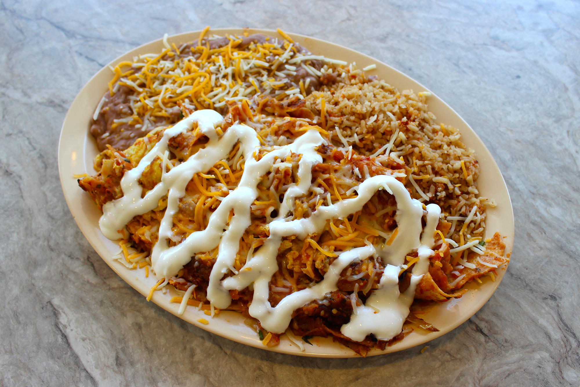 Order Chilaquiles food online from Louis Place Burgers store, Long Beach on bringmethat.com