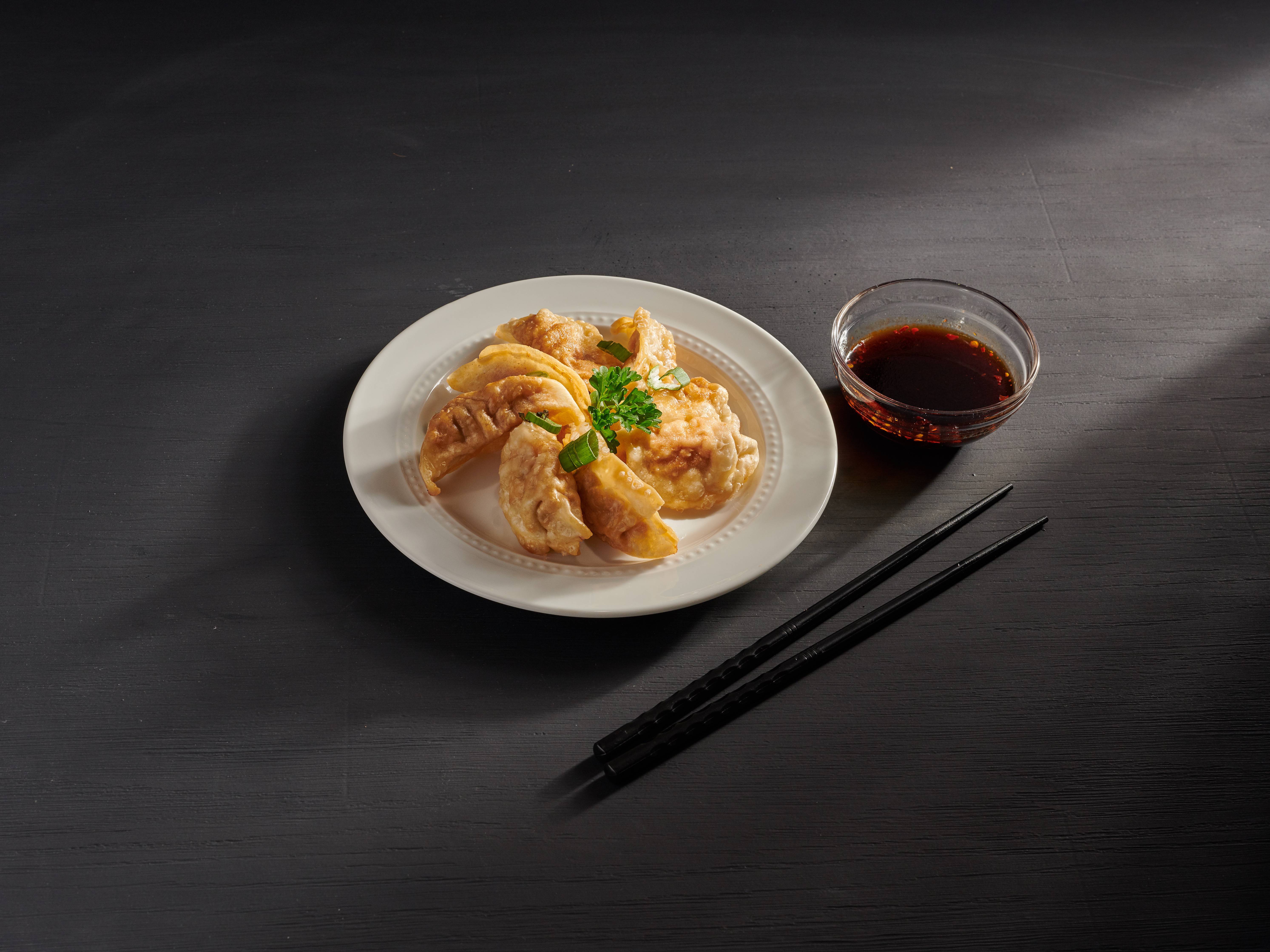 Order 14. Fried Dumplings 锅贴 food online from Hong Kong store, Maple Grove on bringmethat.com