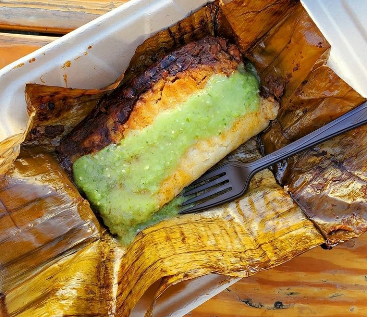 Order Chicken and Mole Tamale (wrapped in banana leaf)  food online from Cafe Con Todo store, Seattle on bringmethat.com