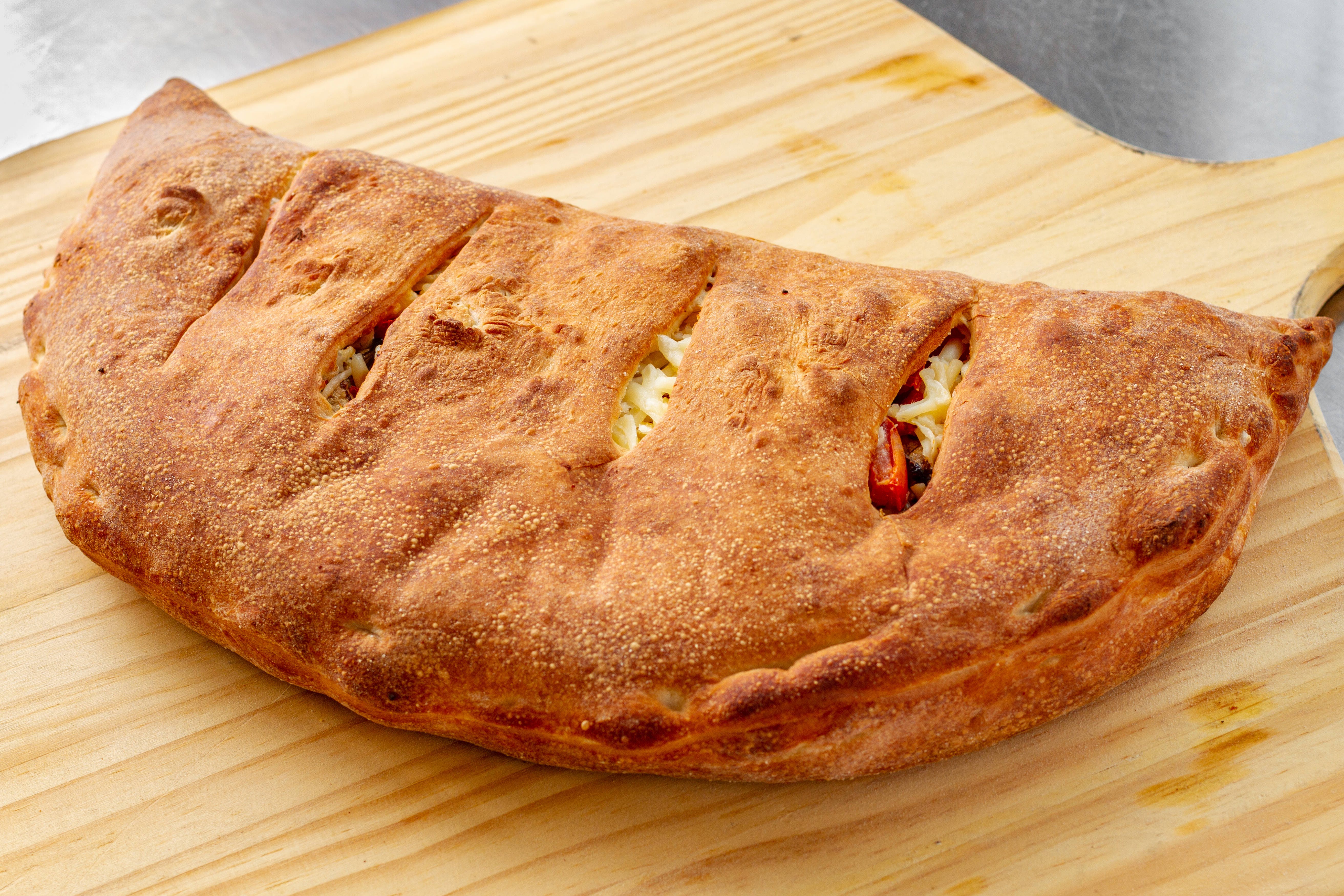 Order Eggplant Calzone - Calzone food online from Al Pacino Pizza store, Baltimore on bringmethat.com
