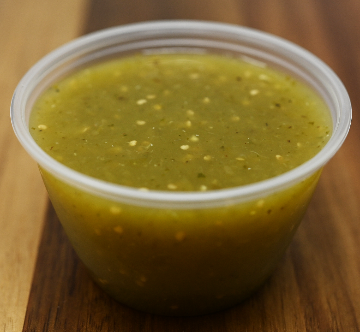 Order Side of Green Tomatillo Sauce 2 oz (Med Hot) food online from Mixteco Mexican Grill store, Chicago on bringmethat.com
