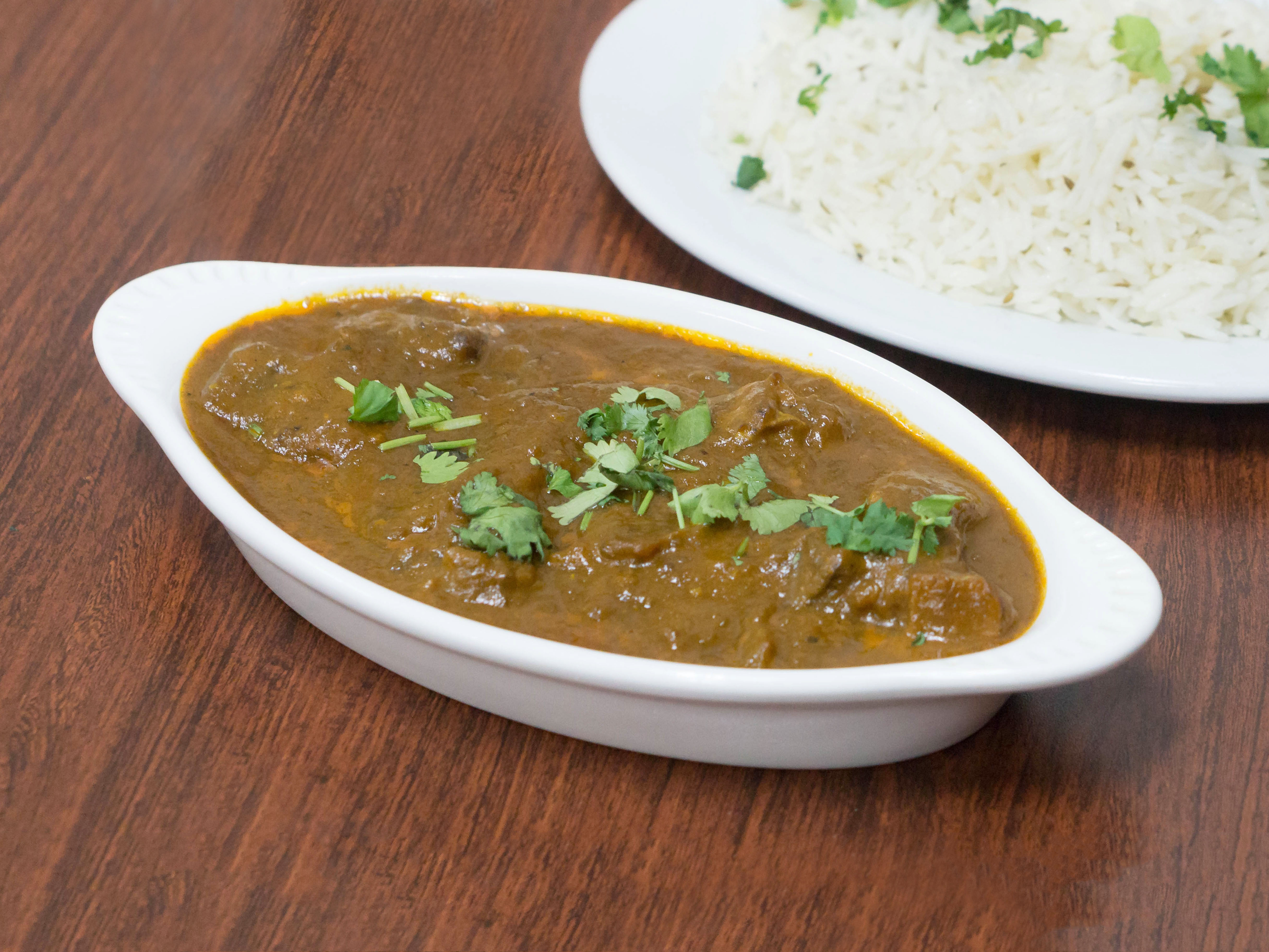 Order 10. Goat Curry food online from Standard Sweets & Spices store, Fresno on bringmethat.com