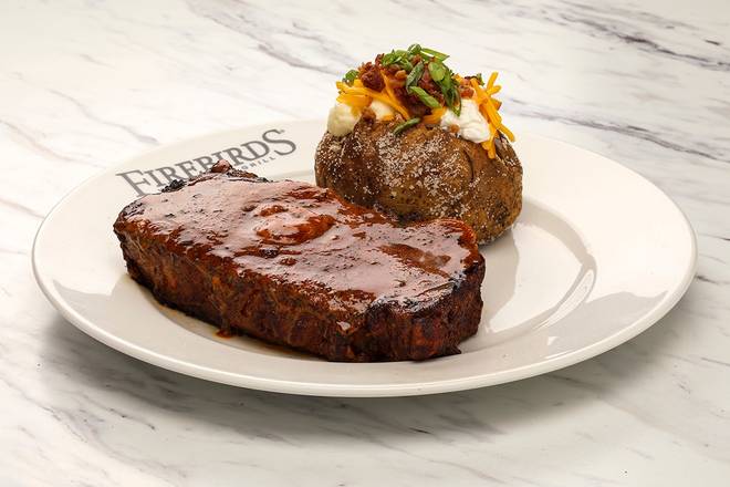 Order Cajun Ribeye* food online from Firebirds Wood Fired Grill store, Cranberry Township on bringmethat.com