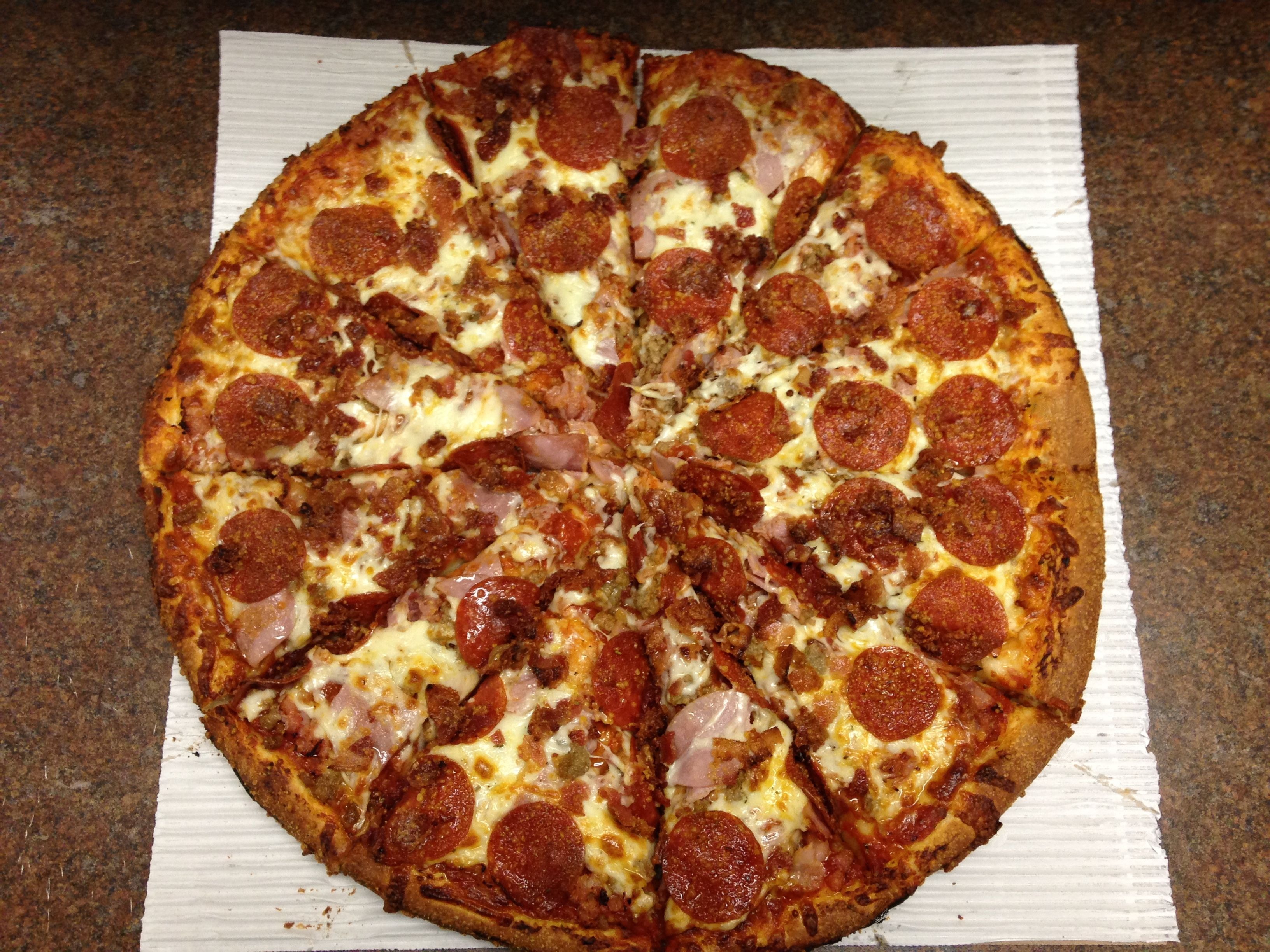 Order Meatzza Pizza - 14" Medium food online from Powerhouse Pizza store, Camden on bringmethat.com