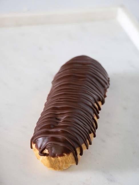 Order Chocolate Pudding Eclair food online from Carlo's Bakery store, Bethlehem on bringmethat.com