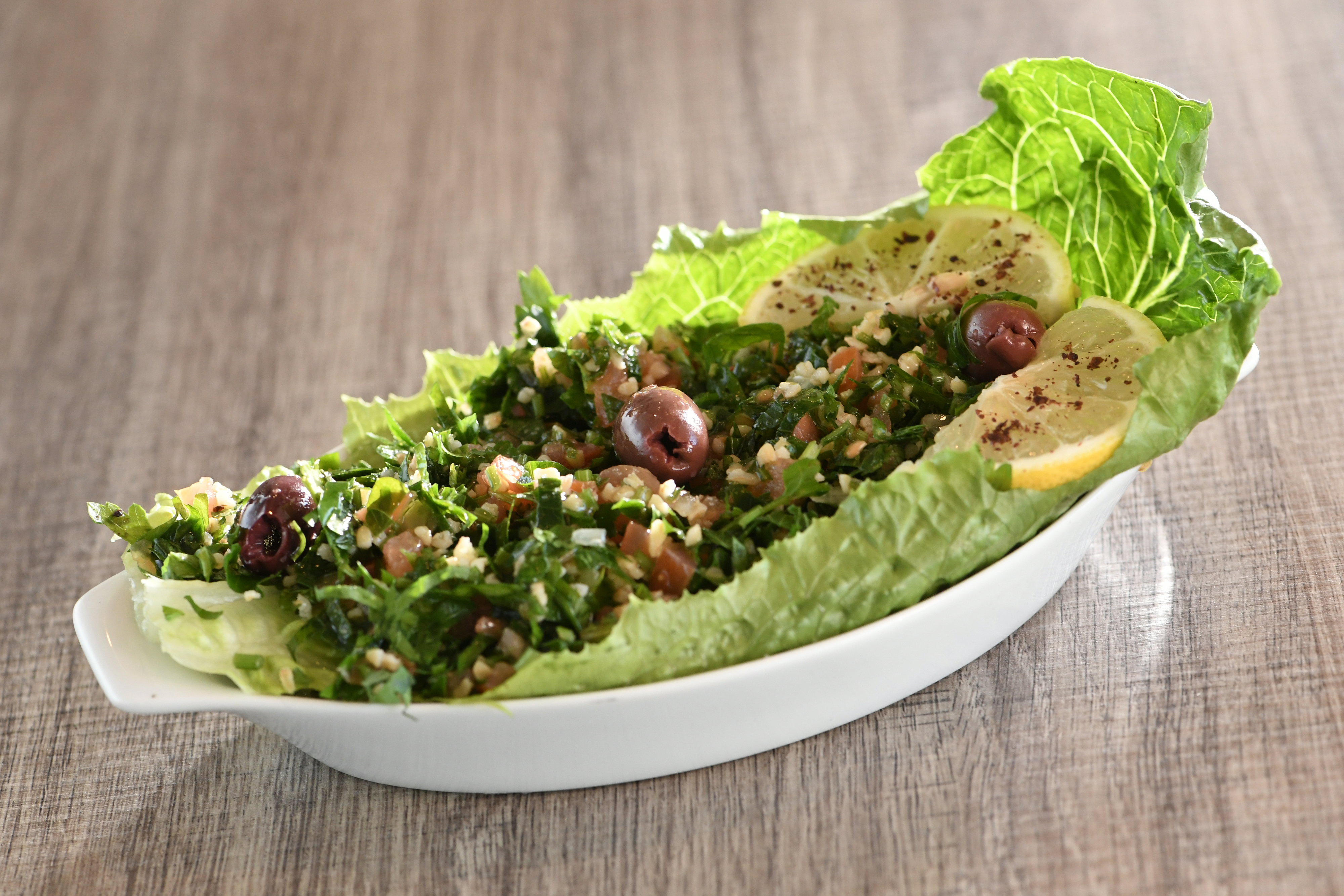 Order Tabbouleh Salad food online from Shisha Cafe store, San Antonio on bringmethat.com