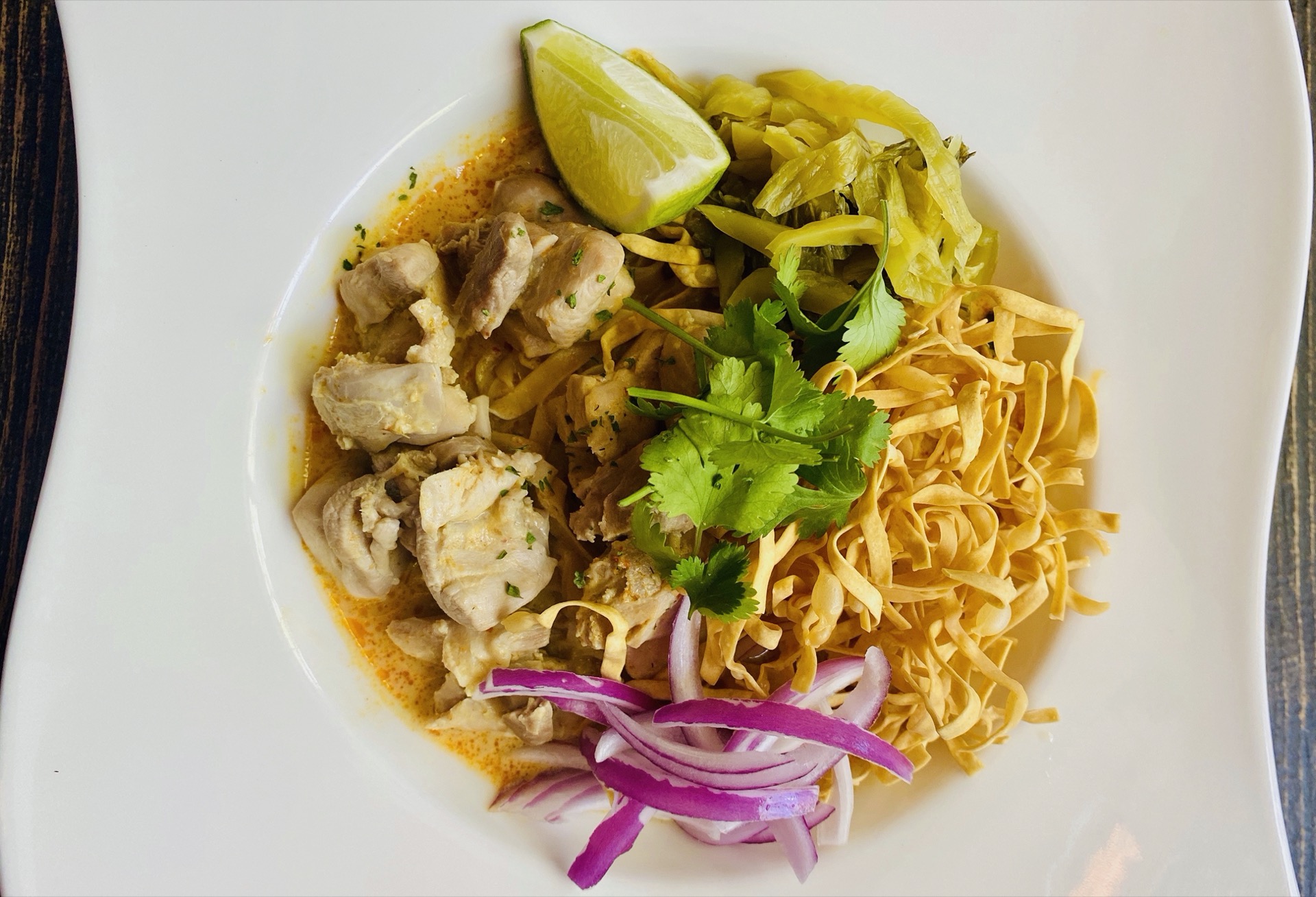 Order Khao Soi food online from Krua Thai store, San Francisco on bringmethat.com
