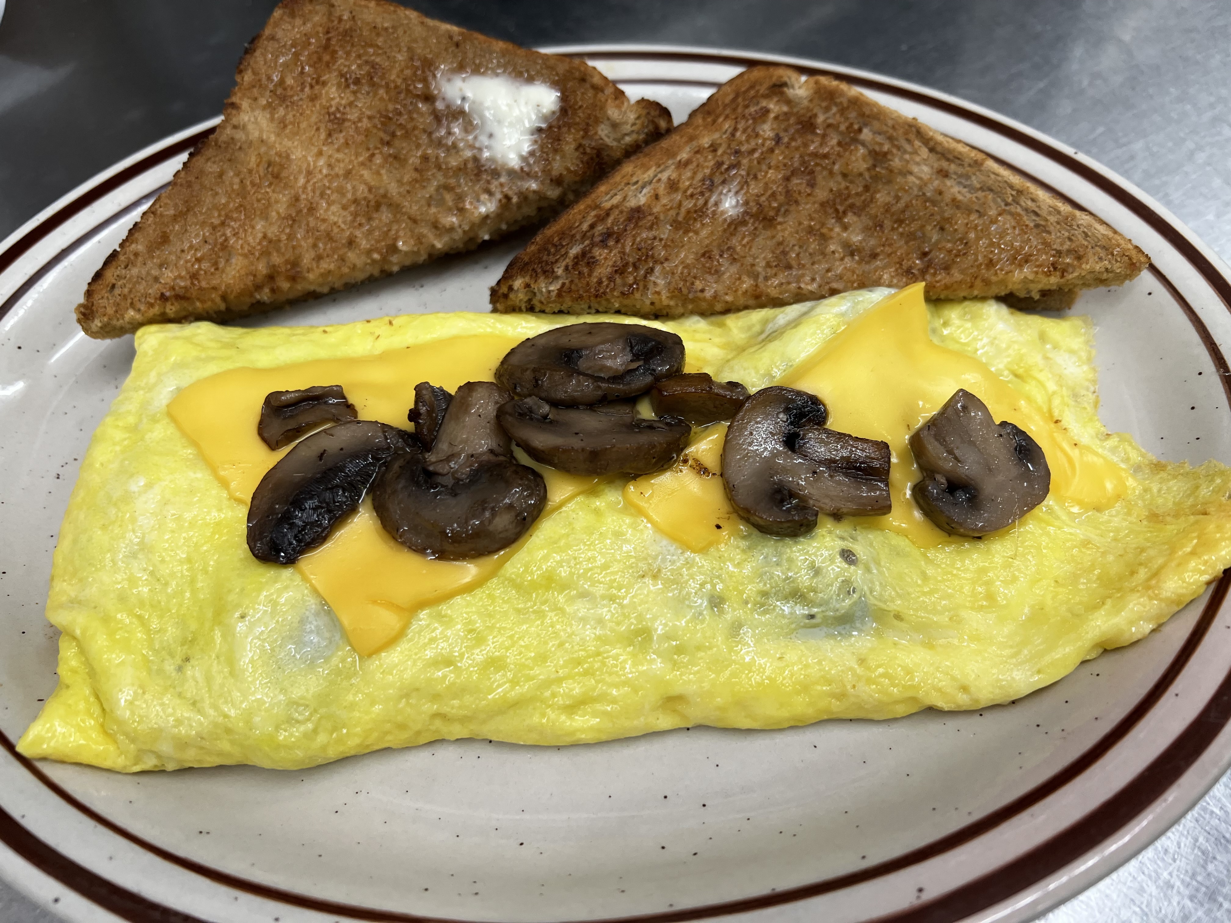 Order Mushroom and Cheese Omelet food online from Eastridge Family Restaurant store, Rochester on bringmethat.com