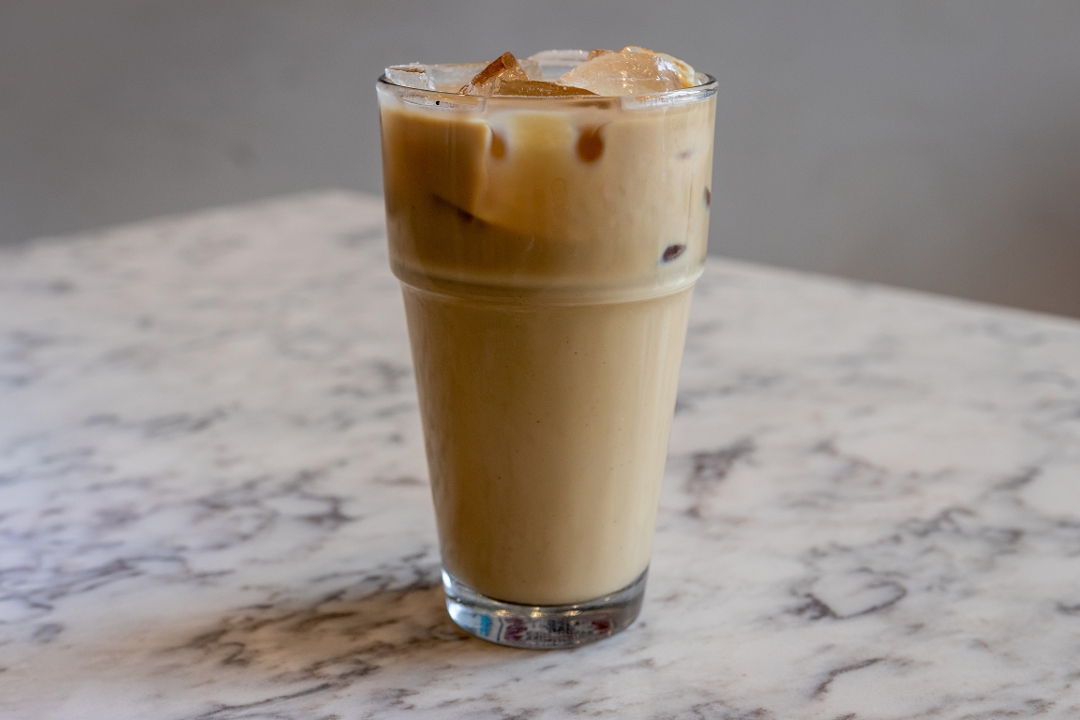 Order Iced Spanish Latte - 16oz food online from Diesel Cafe store, Somerville on bringmethat.com