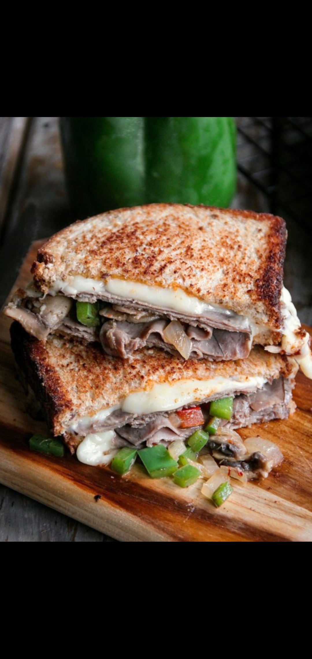 Order Roast Beef Melted swiss mushrooms & peppers Signature Sandwich  food online from American Gourmet Foods Deli store, New York on bringmethat.com