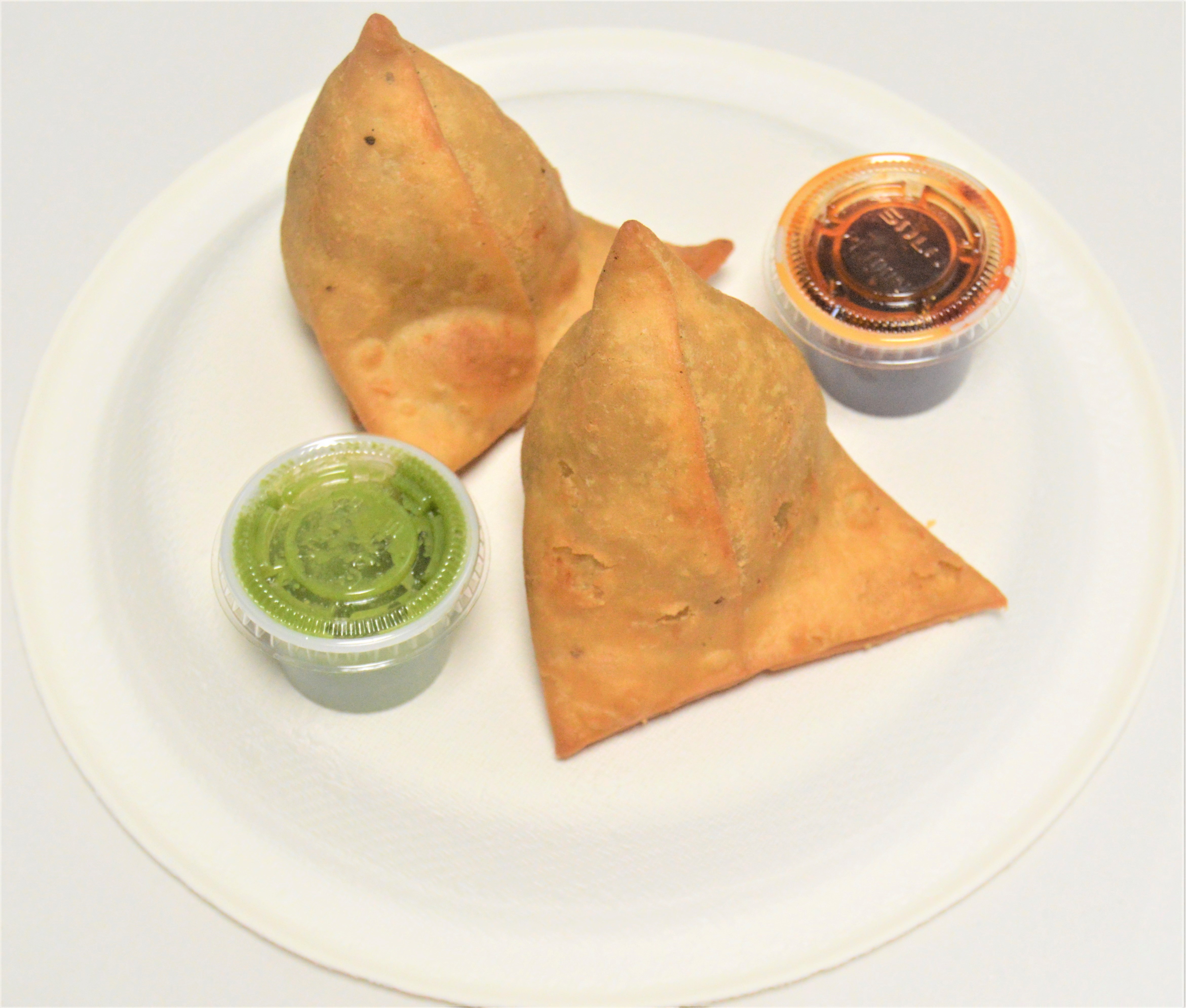 Order 4. Vegetable Samosa food online from Salt And Pepper Grill Iii store, Washington on bringmethat.com