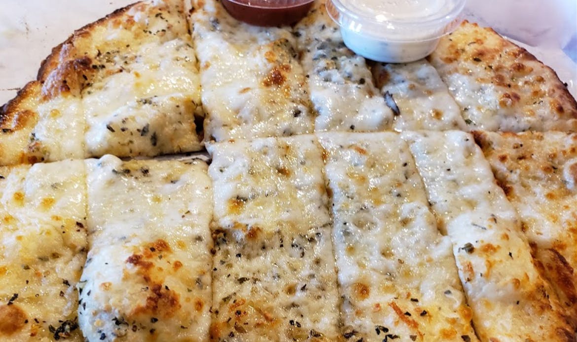 Order Garlic Cheese Naan - Bread food online from Curry Pizza store, Bicknell on bringmethat.com