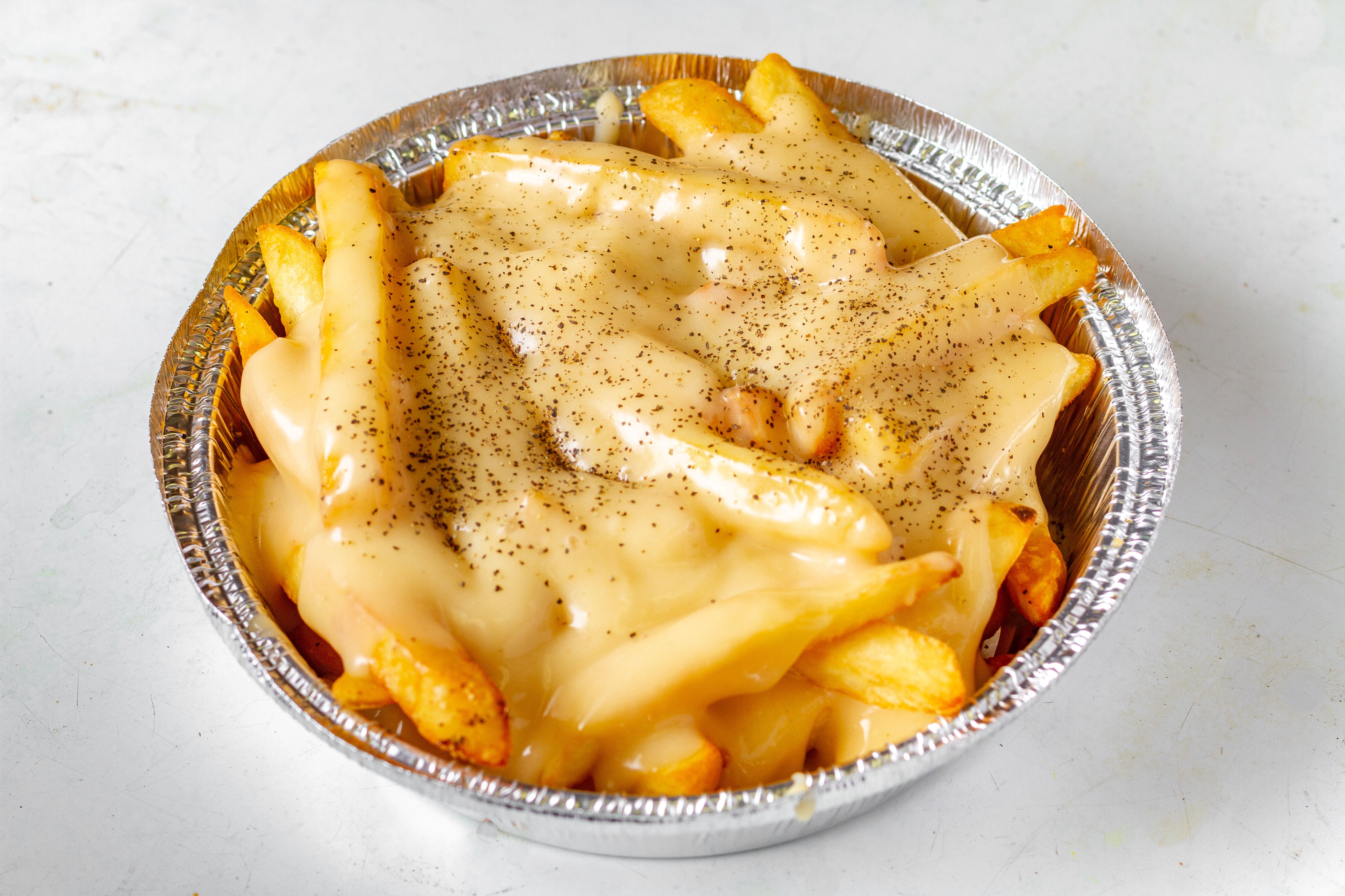 Order French Fries with Gravy - Side food online from Mikie's Pizza & Subs store, Baltimore on bringmethat.com