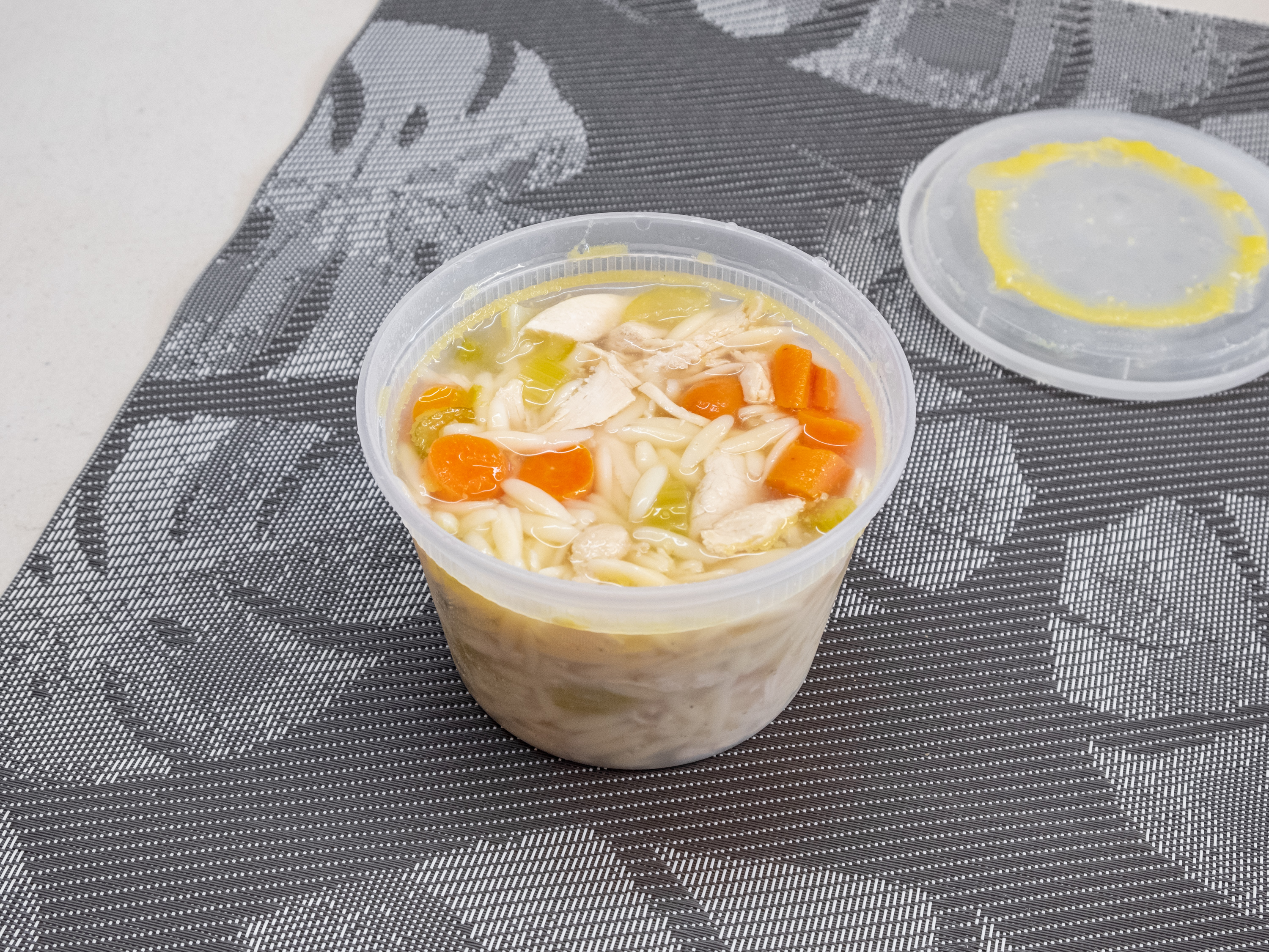 Order  16 fl oz. Cup of Chicken and Orzo Soup food online from Grove Deli Montclair store, Montclair on bringmethat.com
