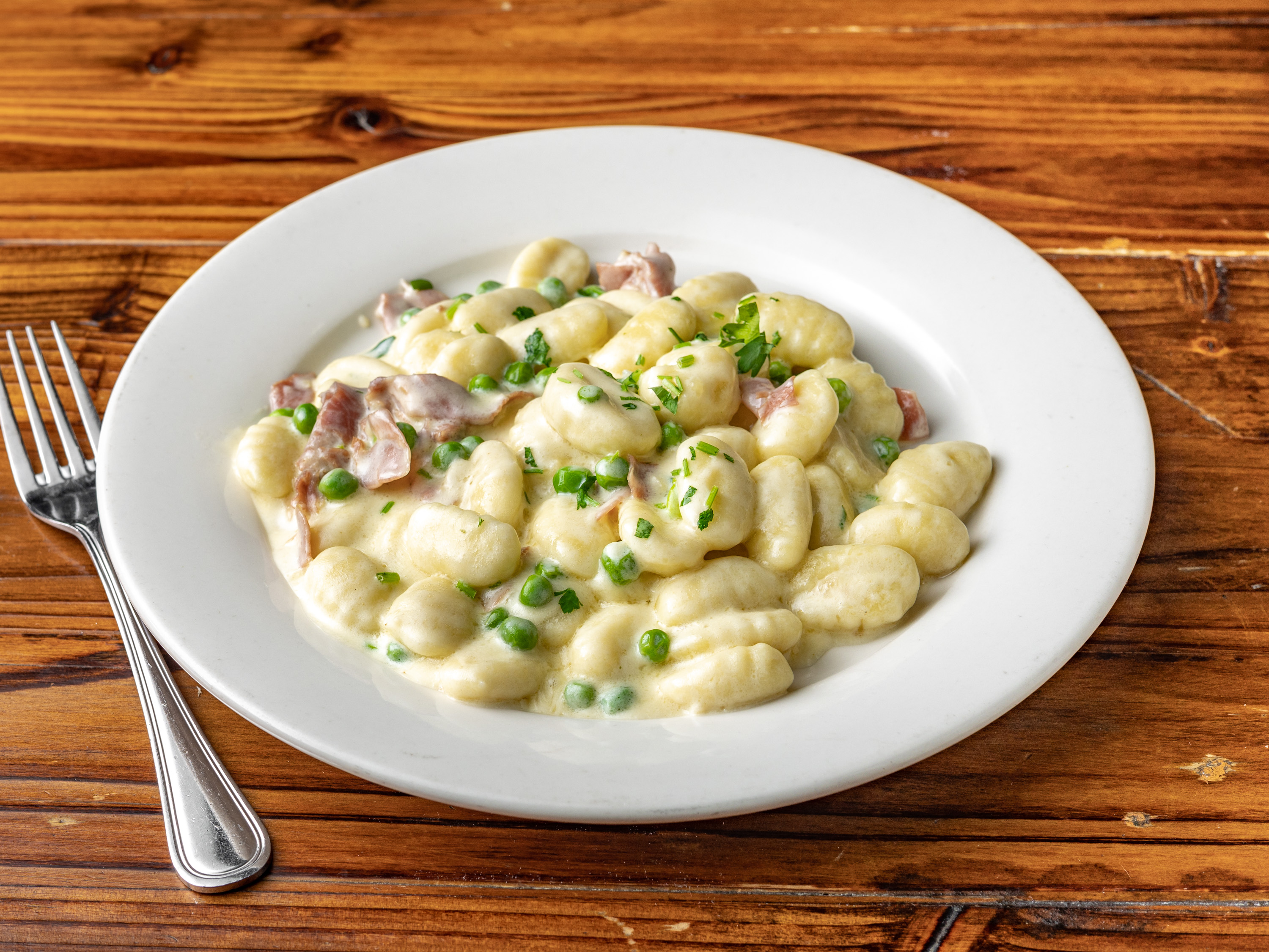 Order Gnocchi Piselli e Prosciutto food online from Tuscan hills store, Forest Hills on bringmethat.com