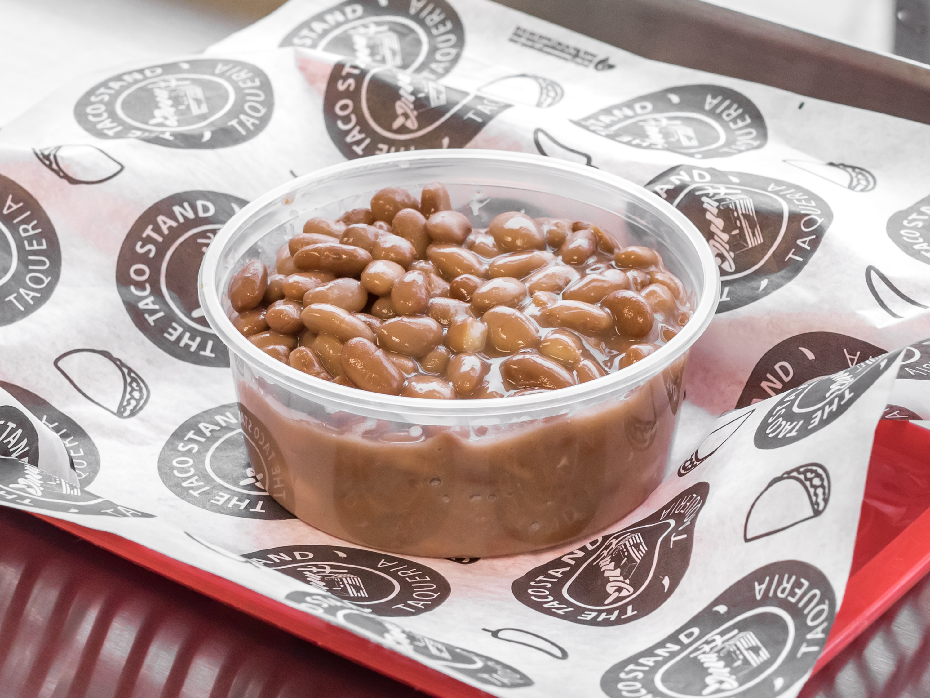 Order 8 oz. Side of Beans food online from The Taco Stand store, Garden City on bringmethat.com