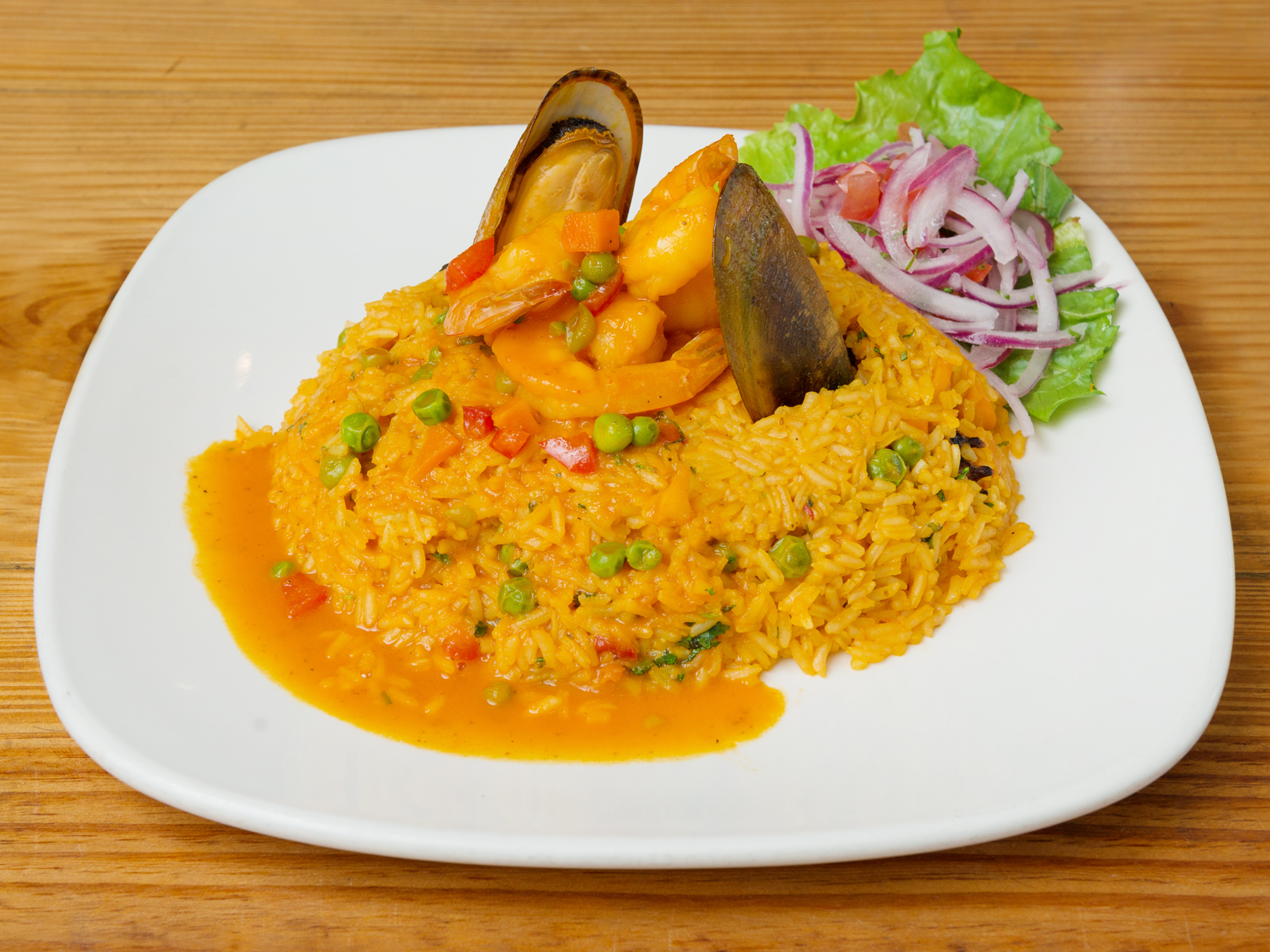 Order Arroz con Mariscos food online from Pachamanka Peruvian Restaurant store, Hollywood on bringmethat.com