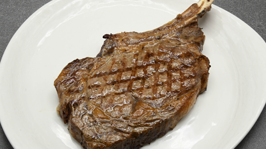Order Prime Cowboy Ribeye 22 oz food online from Mitchell Steakhouse store, Columbus on bringmethat.com