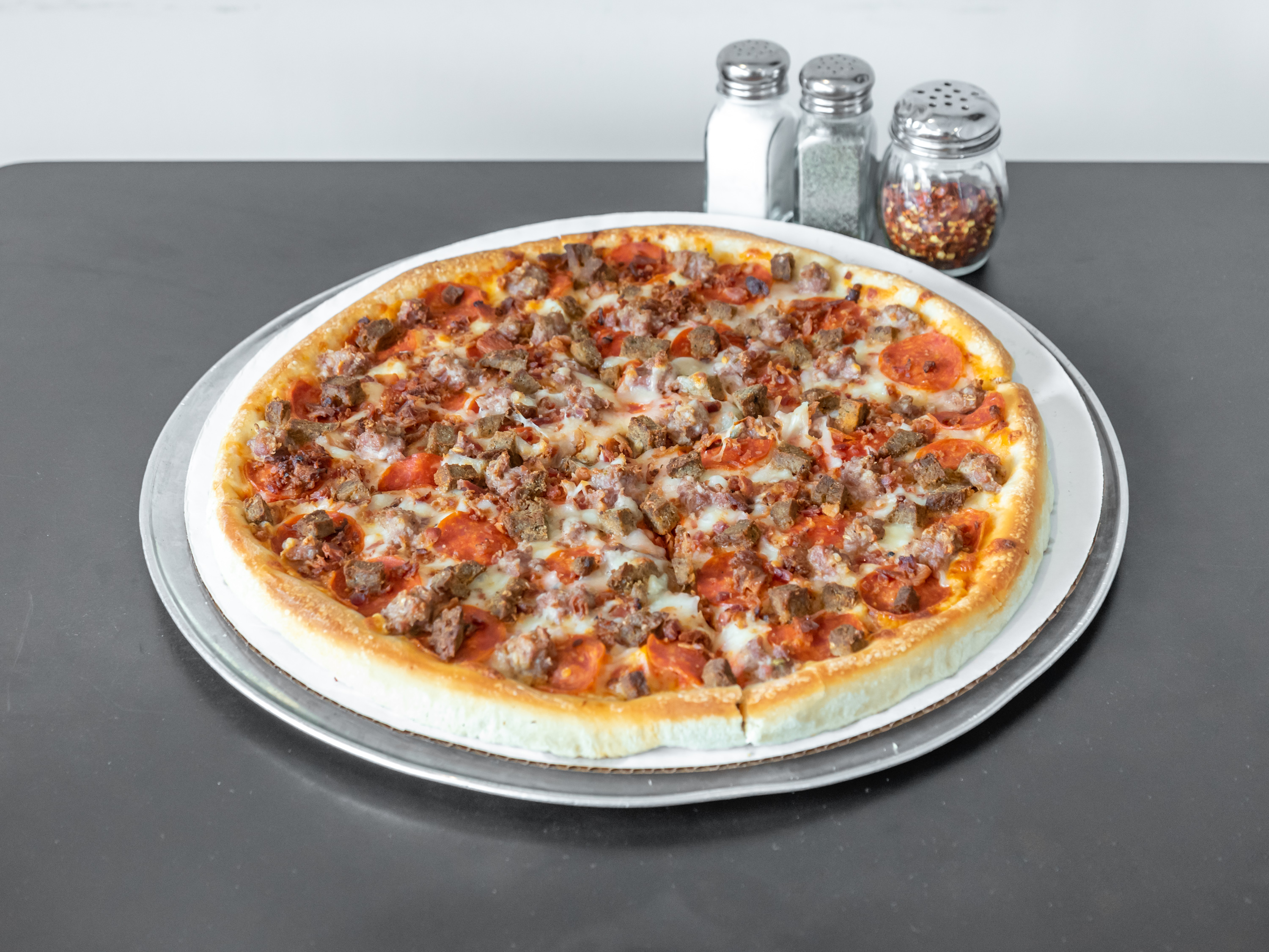 Order Small 10" Meat Lovers Pizza food online from Mikes Pizzeria store, Manchester on bringmethat.com