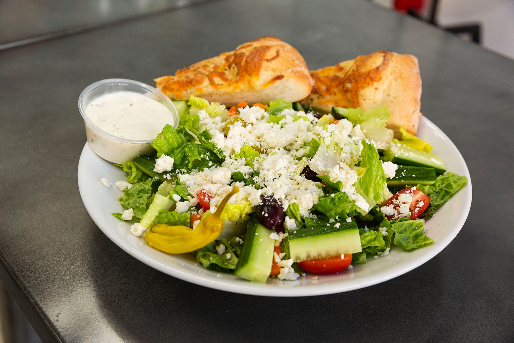 Order Greek Salad - Salads food online from College Pizza store, Boston on bringmethat.com