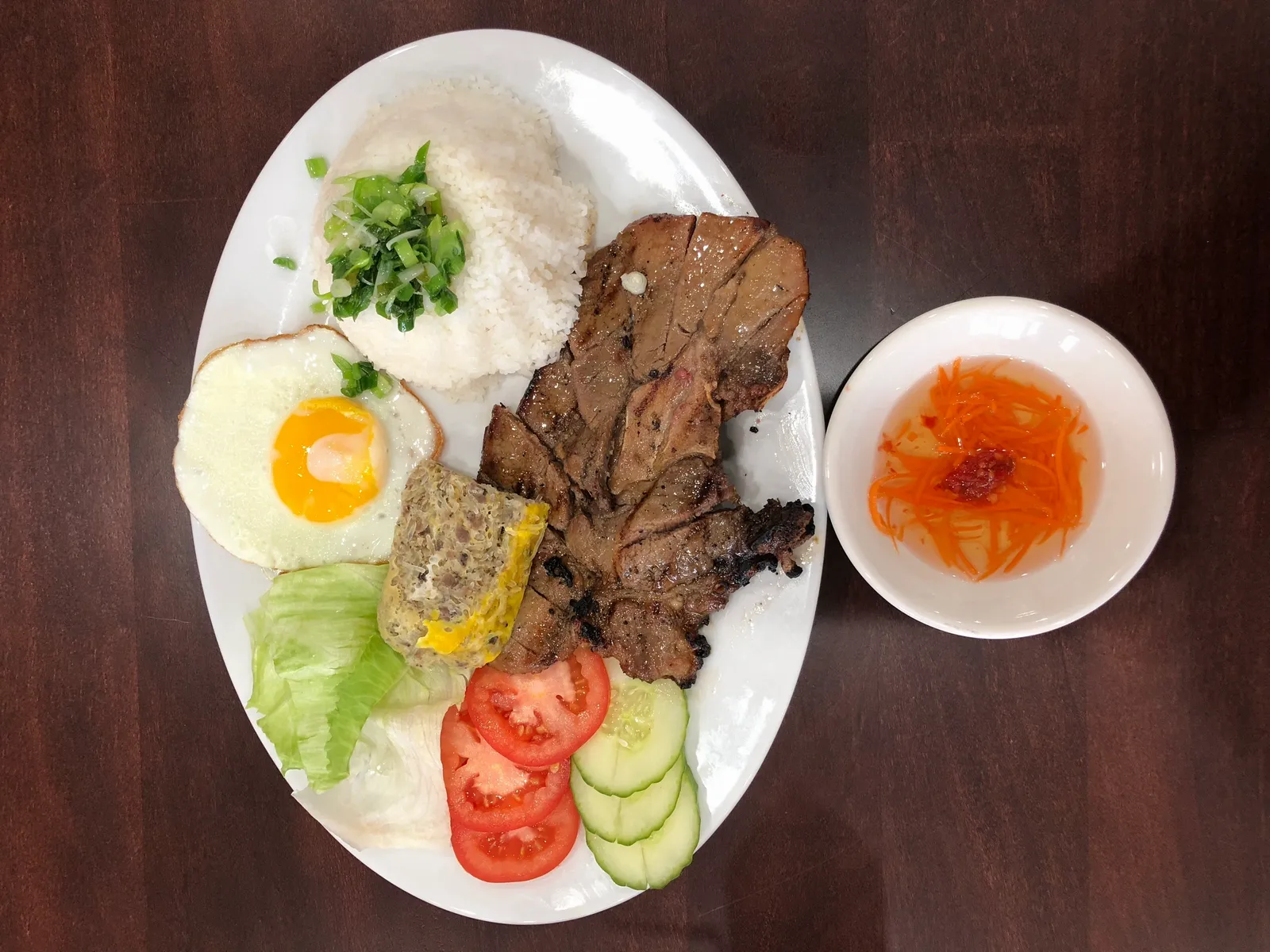 Order C3. Grilled Pork Chops, Pork Meat Pie and Sunny Side up Egg food online from Pho Viet Restaurant store, Hagerstown on bringmethat.com