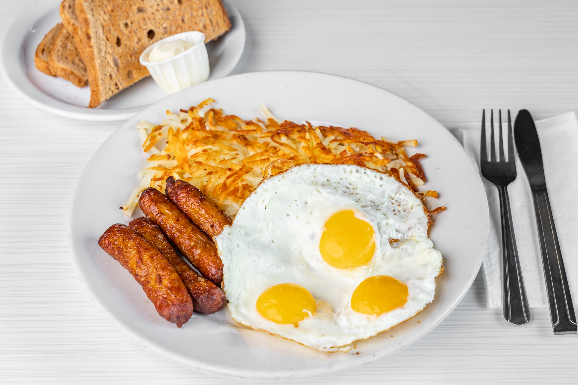 Order 4. Four Piece Sausage and 3 Eggs Breakfast food online from Goody Cafe store, Palm Desert on bringmethat.com