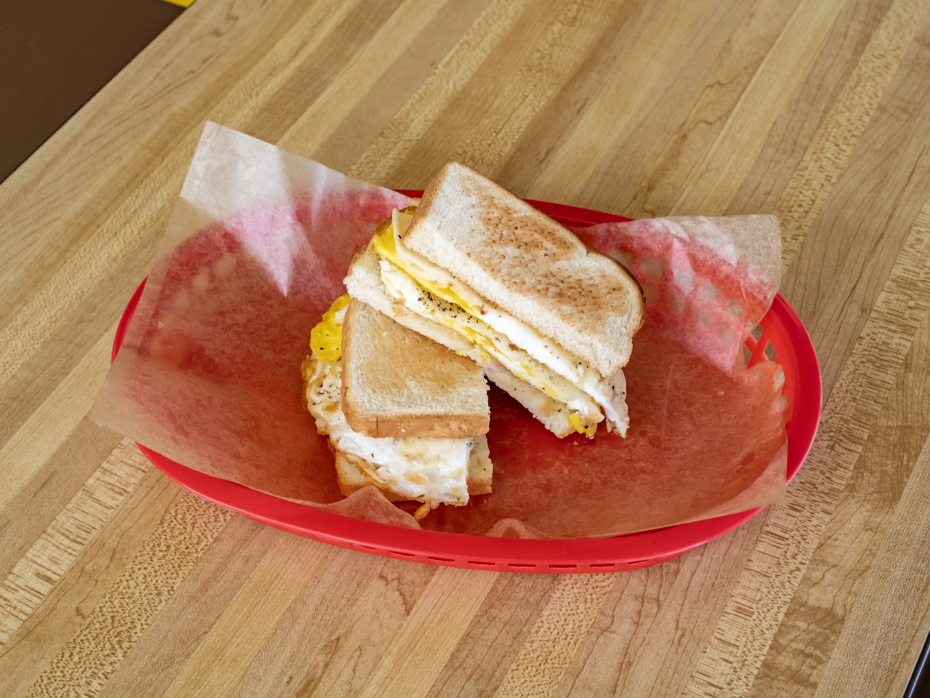 Order #18. Egg and cheese. Toast  food online from Donut Plus store, Orange on bringmethat.com