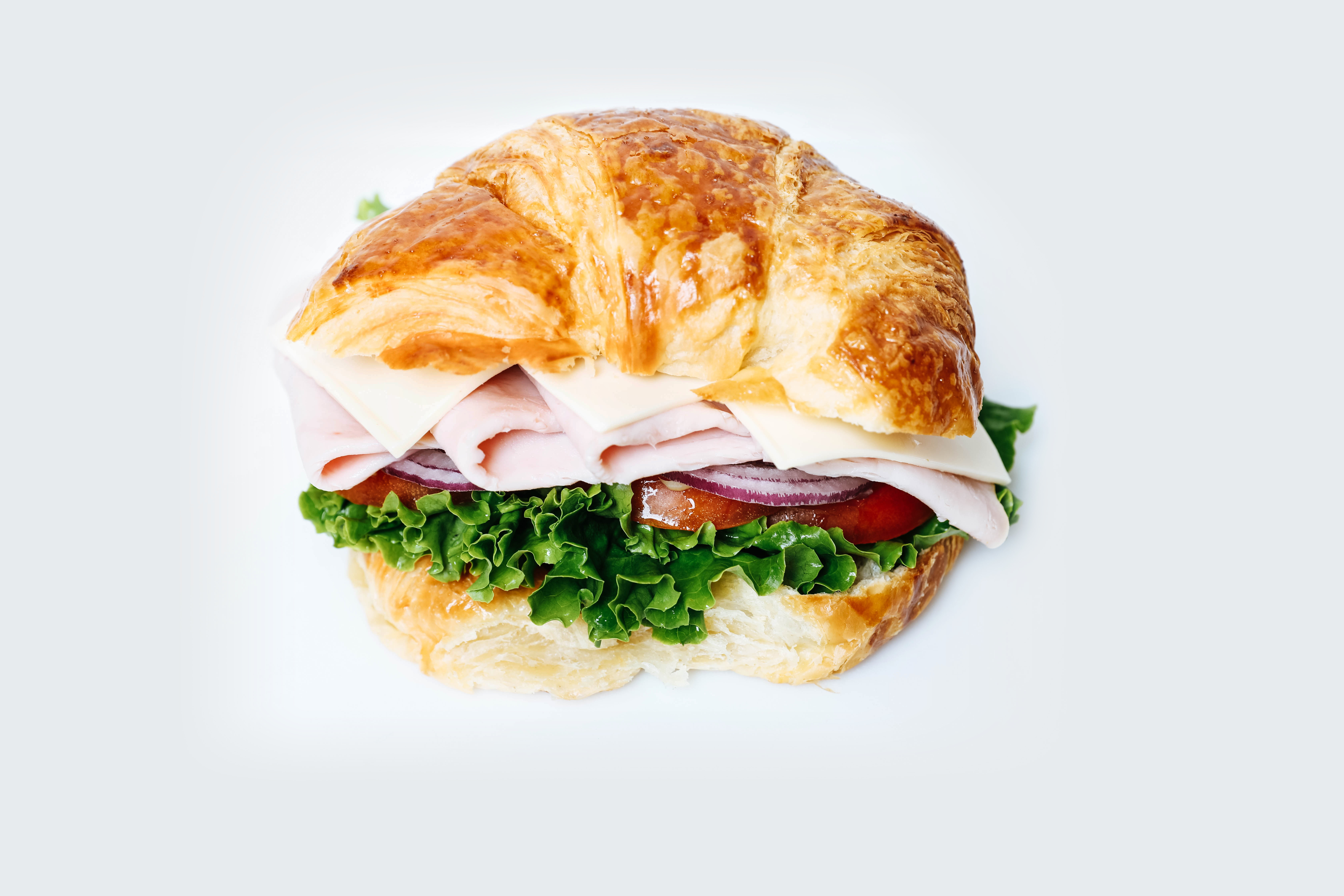 Order #20 Turkey Croissant Lunch food online from Dc Donut Cafe store, Granada Hills on bringmethat.com