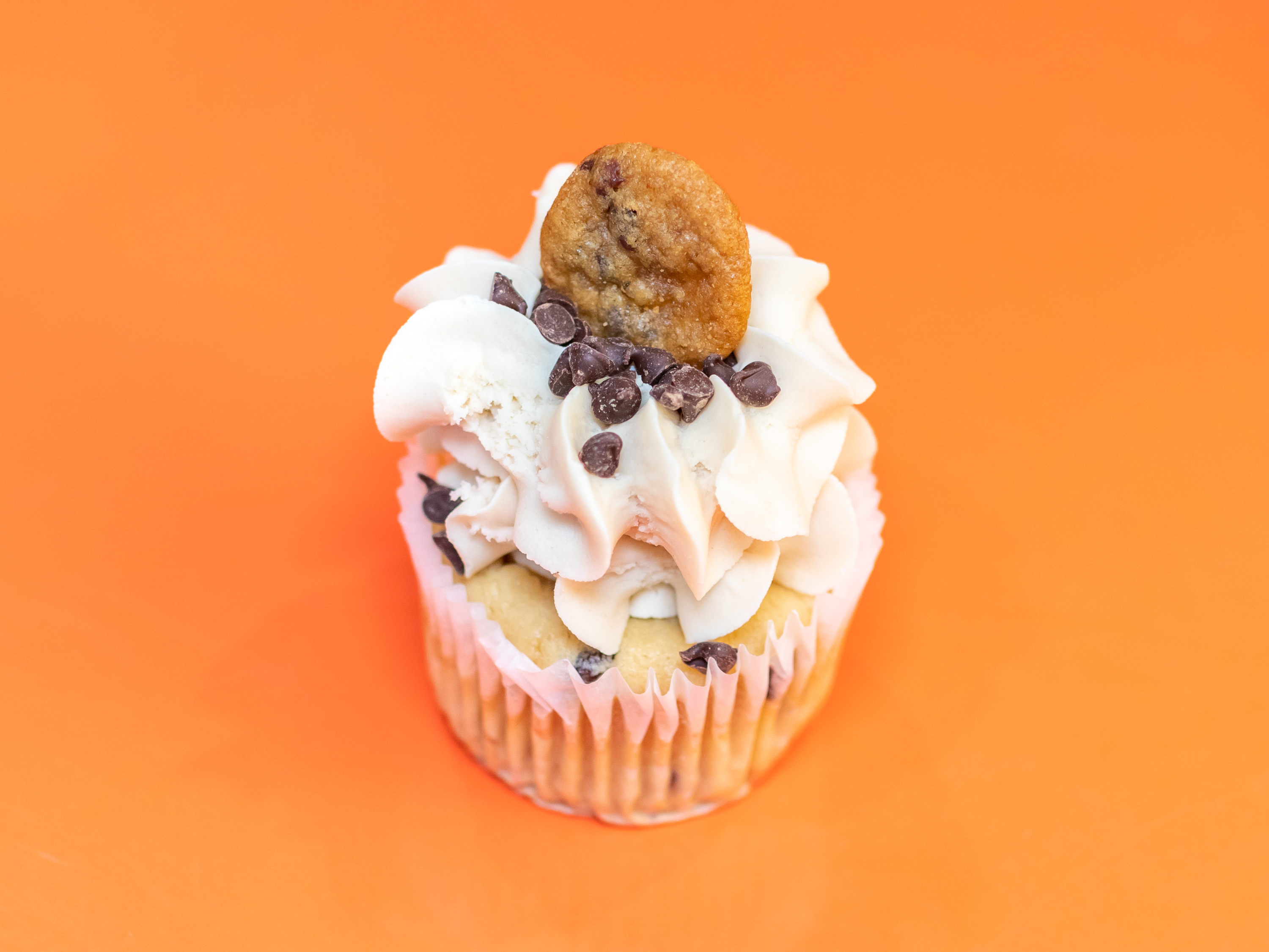 Order Chocolate Chip Cookie Dough Cupcake food online from Gigi's Cupcakes store, Omaha on bringmethat.com