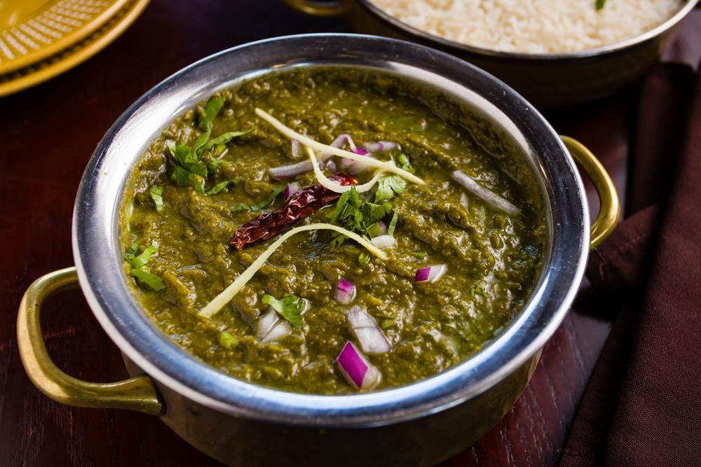 Order Sarson da Saag food online from Dhaba indian cuisine store, New York on bringmethat.com