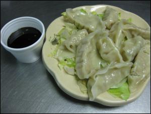 Order A6. Steamed Dumplings (10) food online from Moon Wok store, Cedar Hill on bringmethat.com