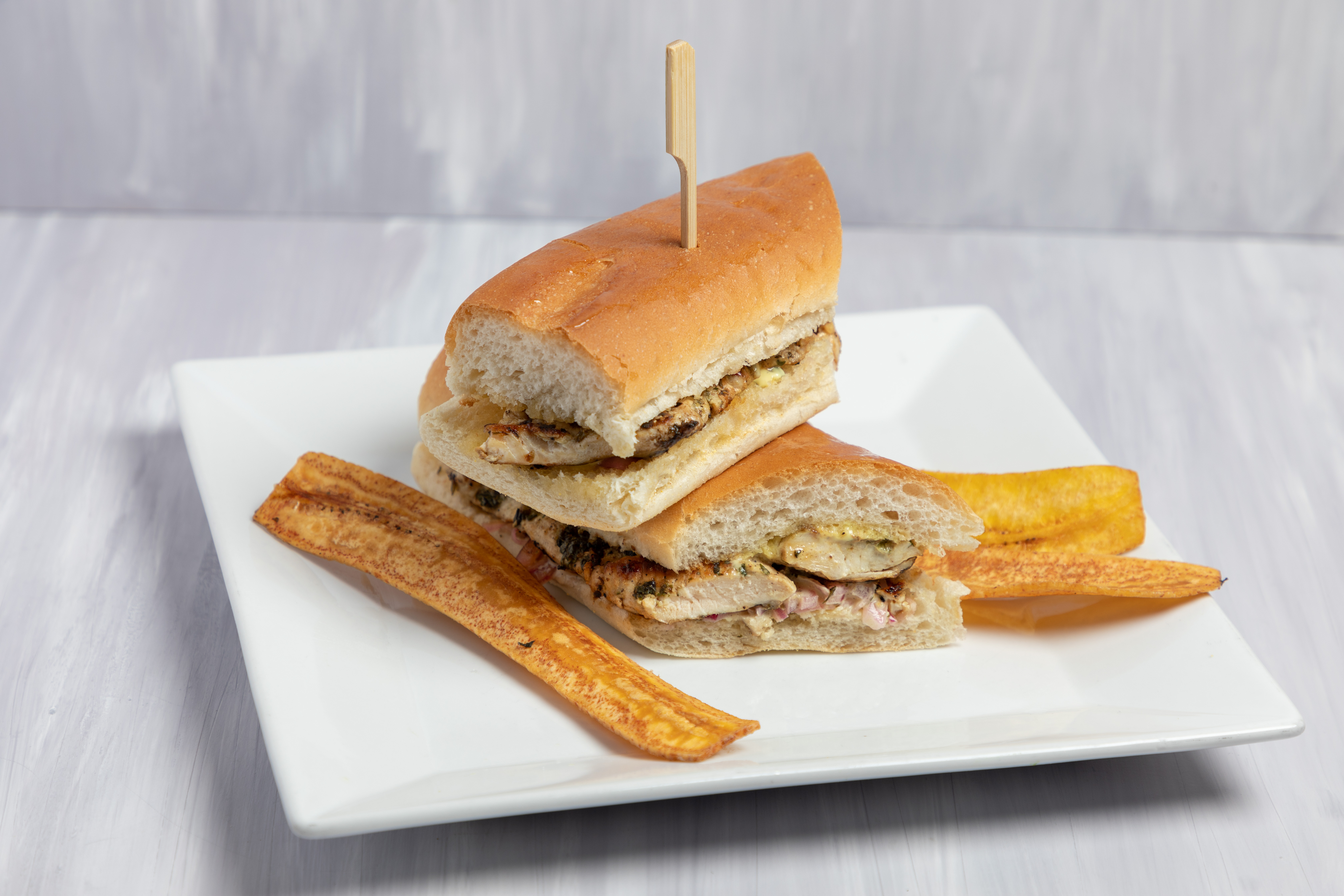 Order Sandwich de pollo  food online from Chango Kitchen store, Hoboken on bringmethat.com