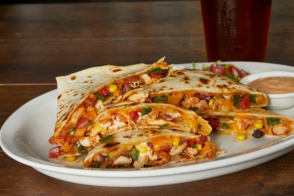 Order ROASTED CHILE SPICED CHICKEN QUESADILLA food online from Miller's Ale House store, Levittown on bringmethat.com