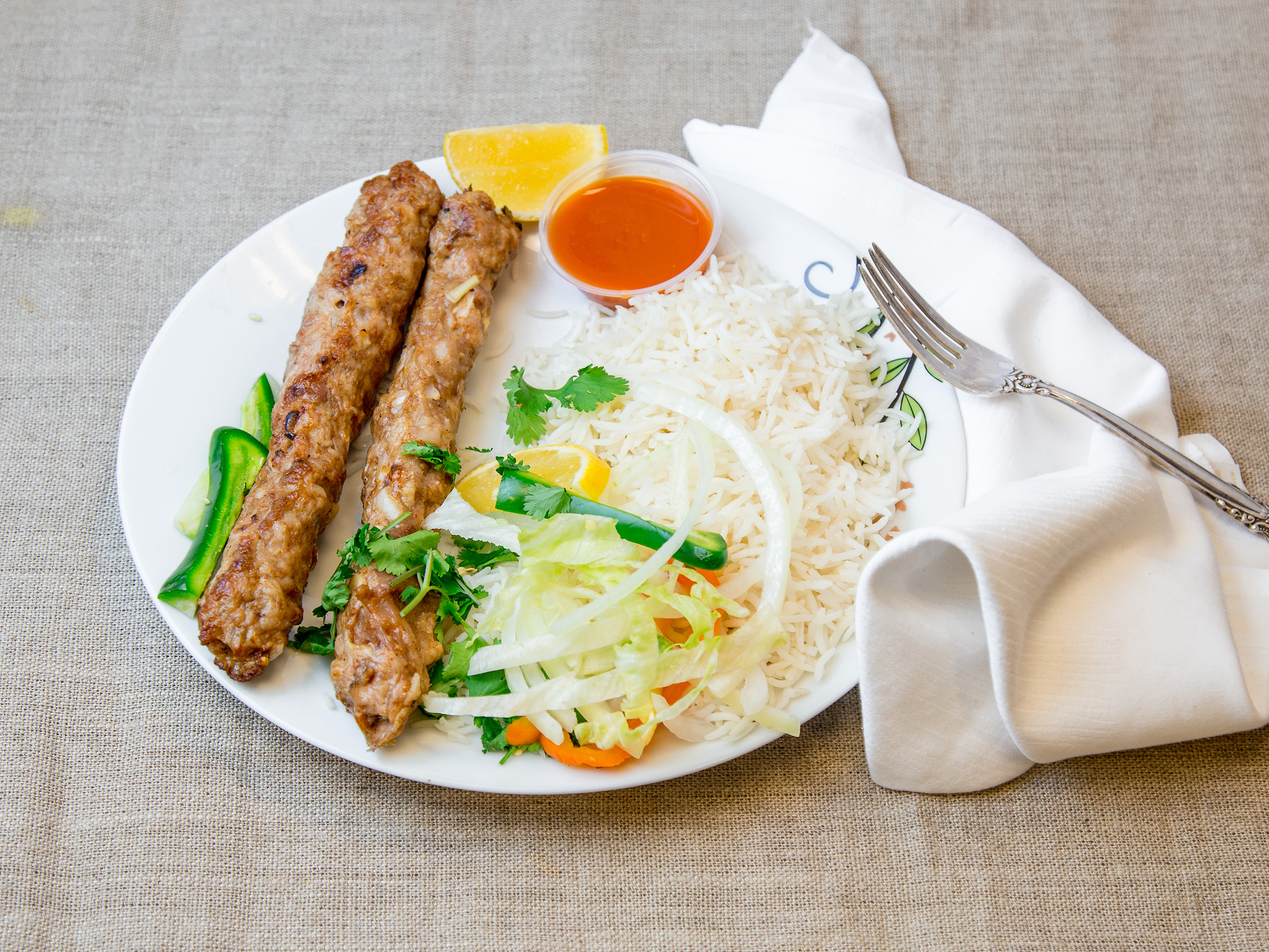 Order Chicken Sheek Kabab with Rice and Salad food online from Halal Pita Grill store, Chicago on bringmethat.com