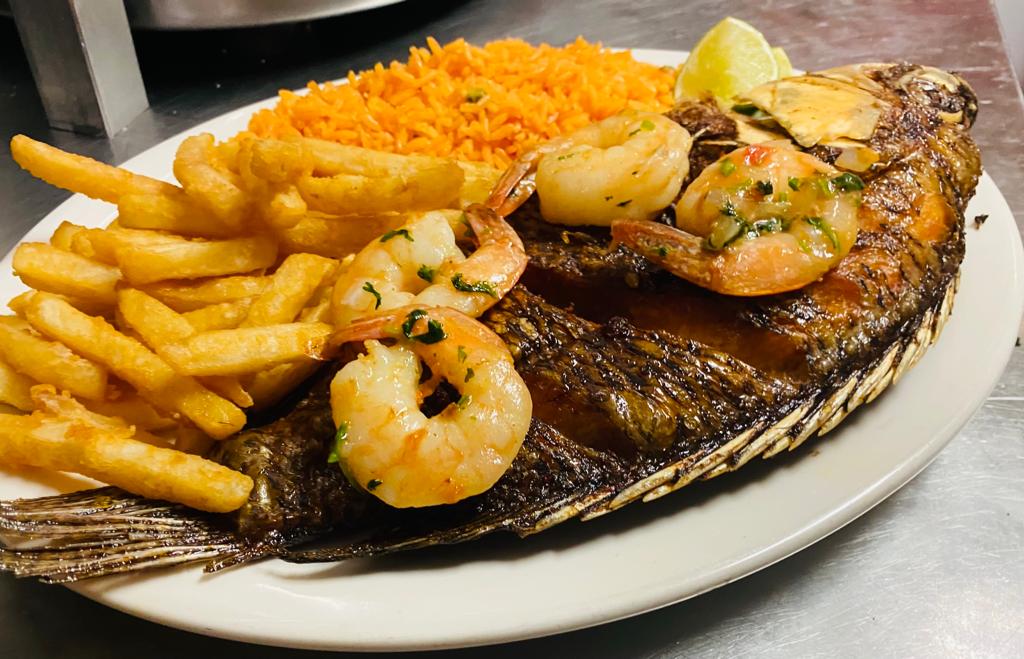 Order Deep Fried Whole Tilapia topped with Shrimps  food online from La Hacienda Restaurant store, Perth Amboy on bringmethat.com