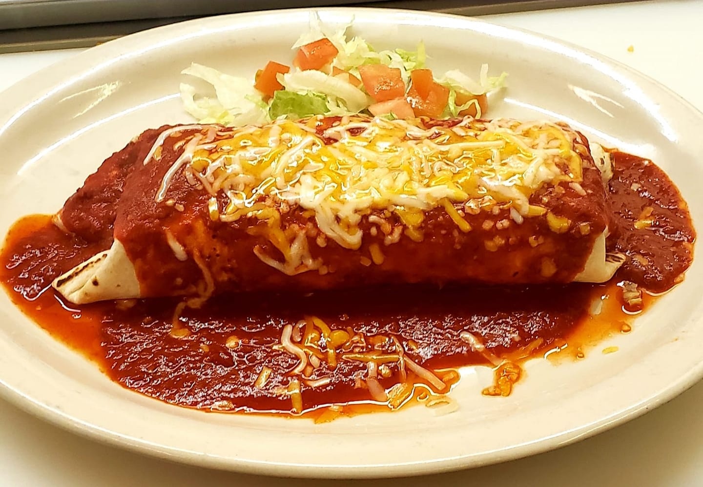 Order Red Chile Pork Burrito food online from El Jacalito store, Las Cruces on bringmethat.com